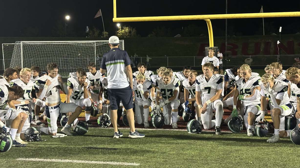 Head coach Austin Heaps of Timpanogos talks to his team following a win versus Mountain View.