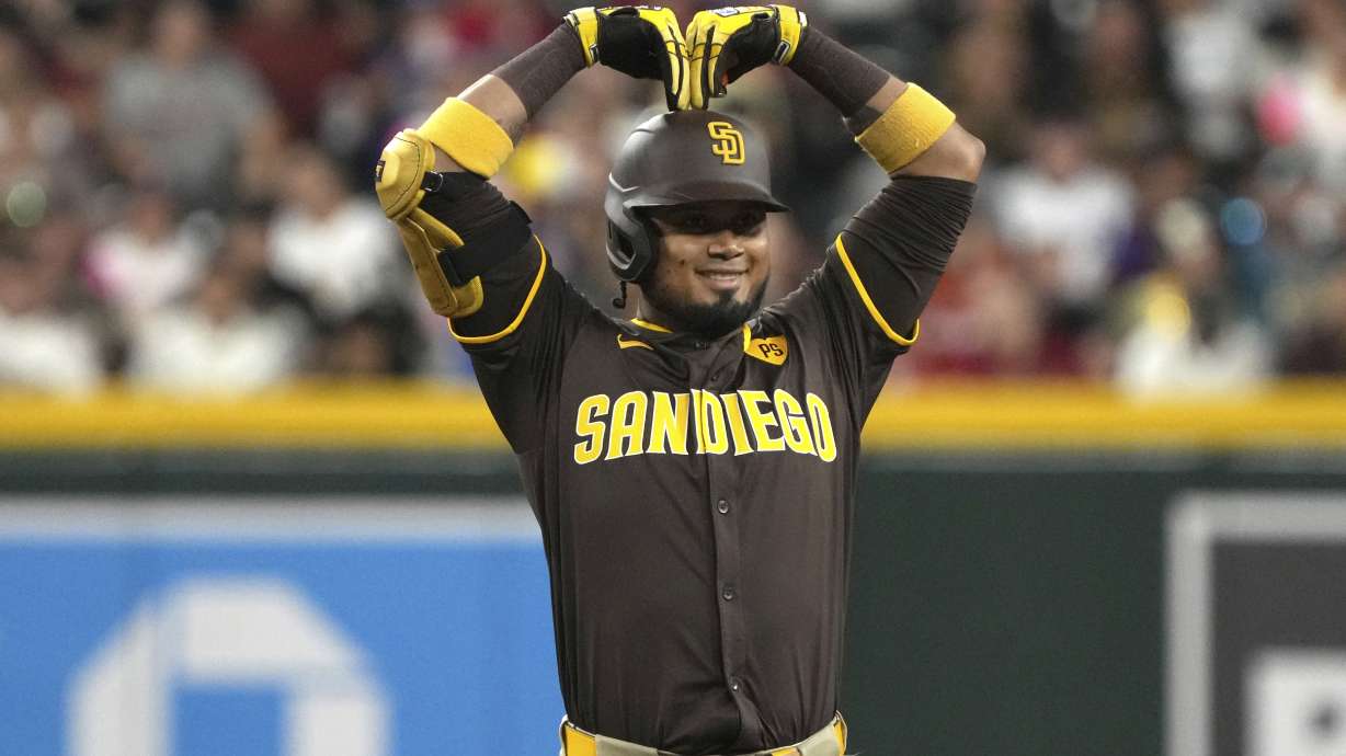 San Diego Padres' Luis Arraez reacts after hitting a double against the Arizona Diamondbacks in the first inning during a baseball game, Friday, Sept. 27, 2024, in Phoenix.