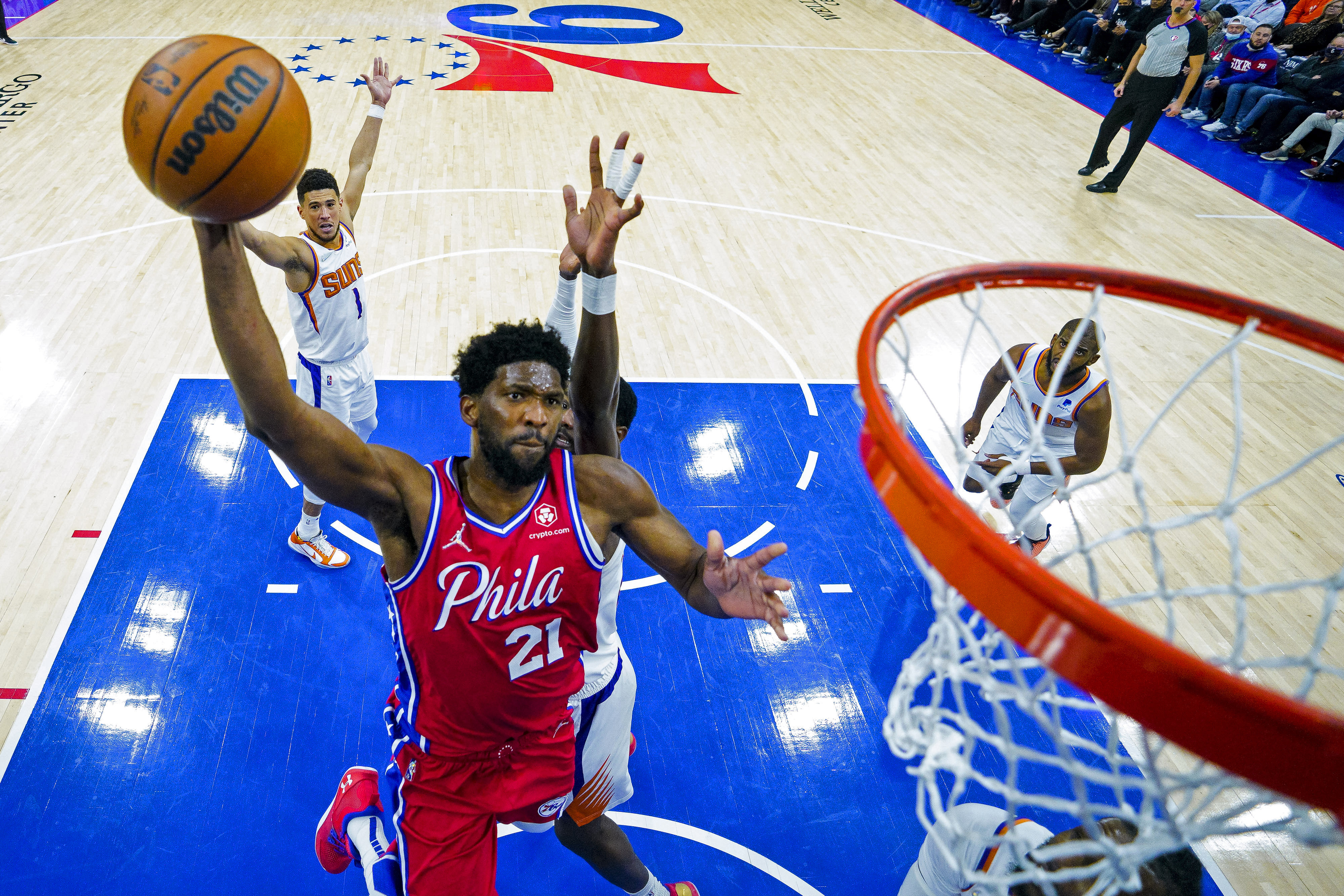 FILE - Philadelphia 76ers' Joel Embiid goes up for the dunk during the second half of an NBA basketball game against the Phoenix Suns, Tuesday, Feb. 8, 2022, in Philadelphia.
