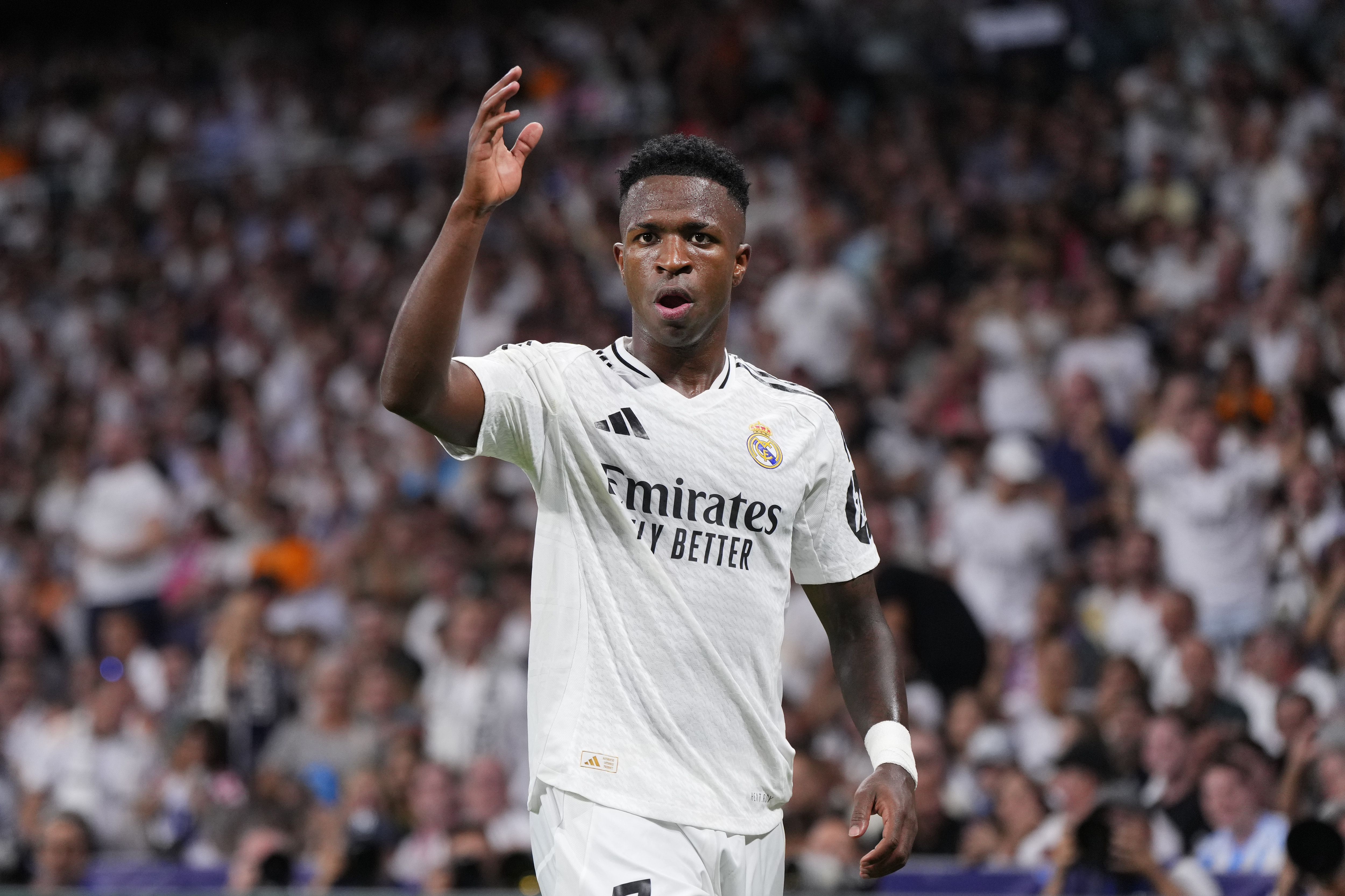 Real Madrid's Vinicius Junior gestures during the Champions League opening phase soccer match between Real Madrid and VfB Stuttgart at the Santiago Bernabeu stadium, in Madrid, Tuesday, Sept. 17, 2024.