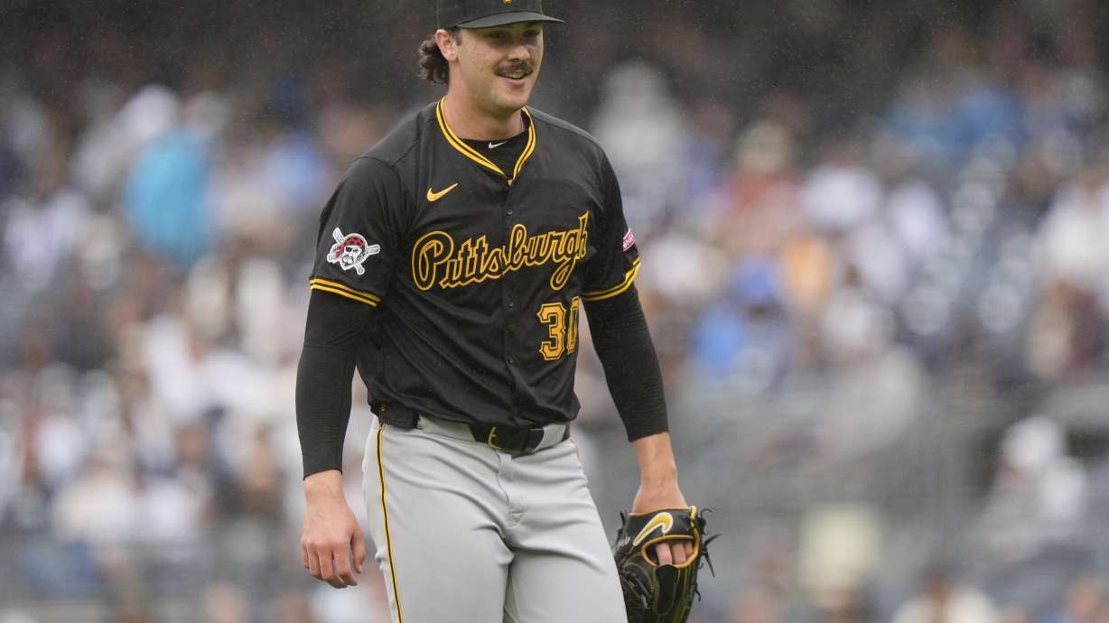 Pittsburgh Pirates' Paul Skenes smiles after the second inning of a baseball game against the New York Yankees, Saturday, Sept. 28, 2024, in New York.