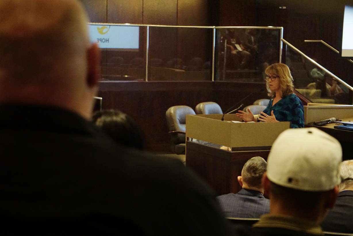 Kathy Mackay, analyst for the Statewide Information and Analysis Center, speaks to family members of those who are murdered and missing at the Hope Conference in Salt Lake City on Saturday.