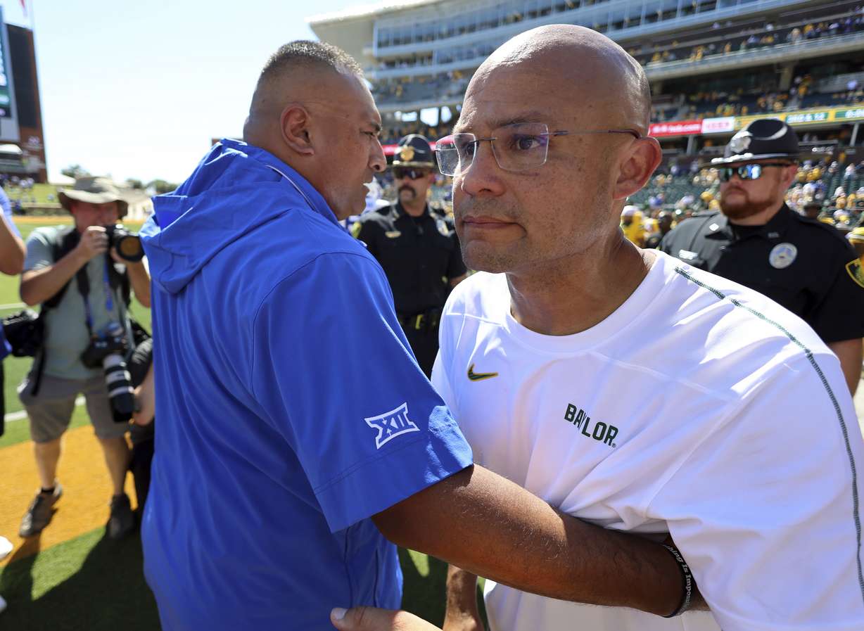 BYU head coach Kalani Sitake, left, hugs Baylor head coach Dave Aranda after an NCAA college football game Saturday, Sept. 28, 2024, in Waco, Texas.