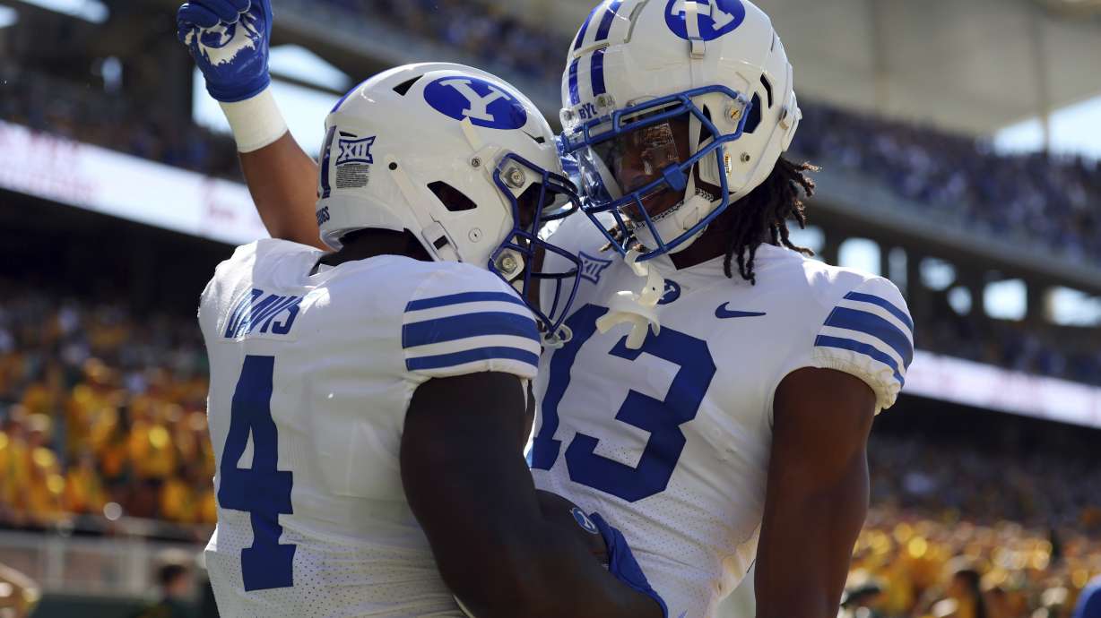 BYU running back Miles Davis (4) celebrates with teammate Jojo Phillips (13) after a touchdown in the first half against Baylor during an NCAA college football game on Saturday, Sept. 28, 2024, in Waco, Texas.