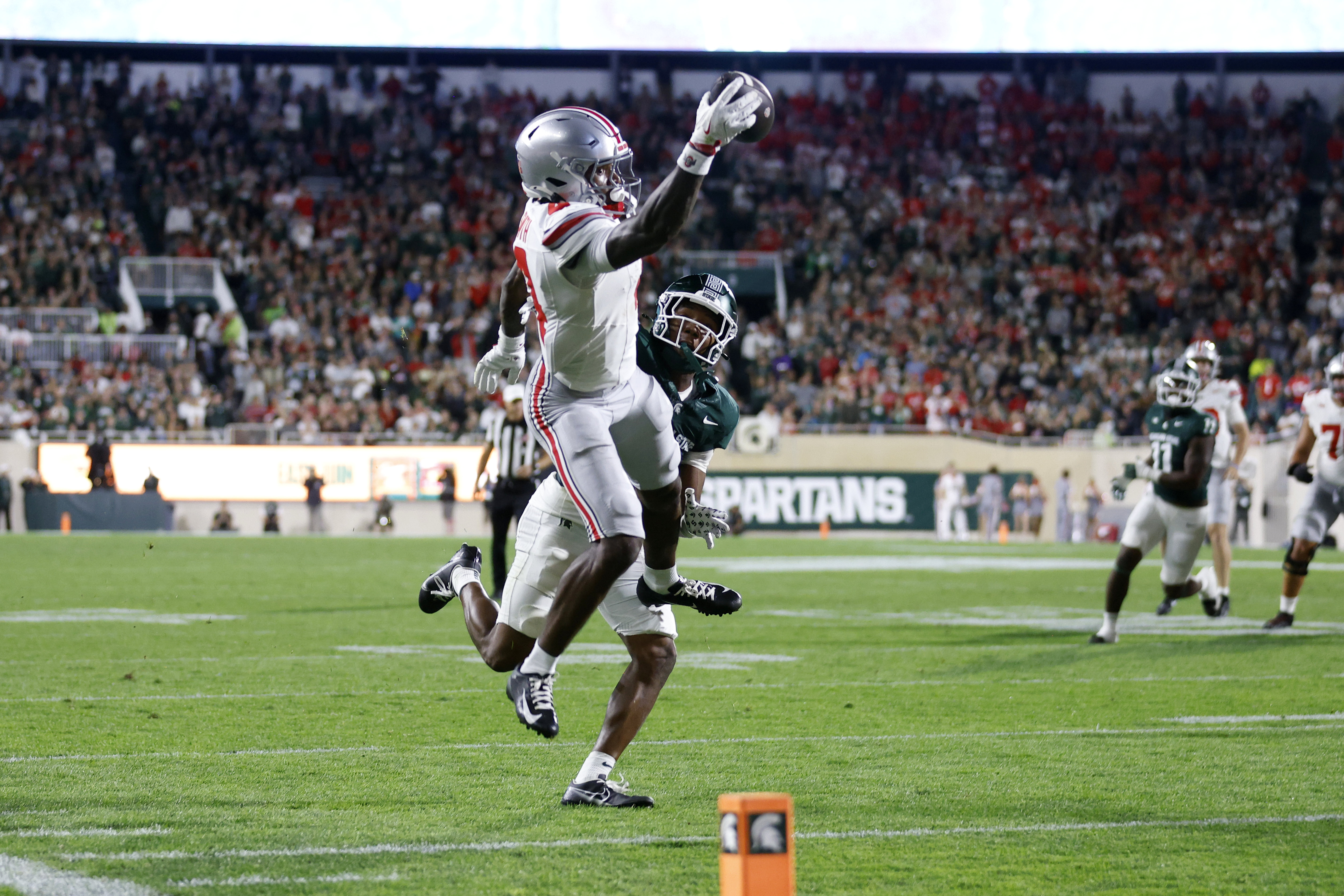 Jeremiah Smith scores 2 TDs in 1st half and helps No. 3 Ohio St pull away and rout Michigan St 38-7