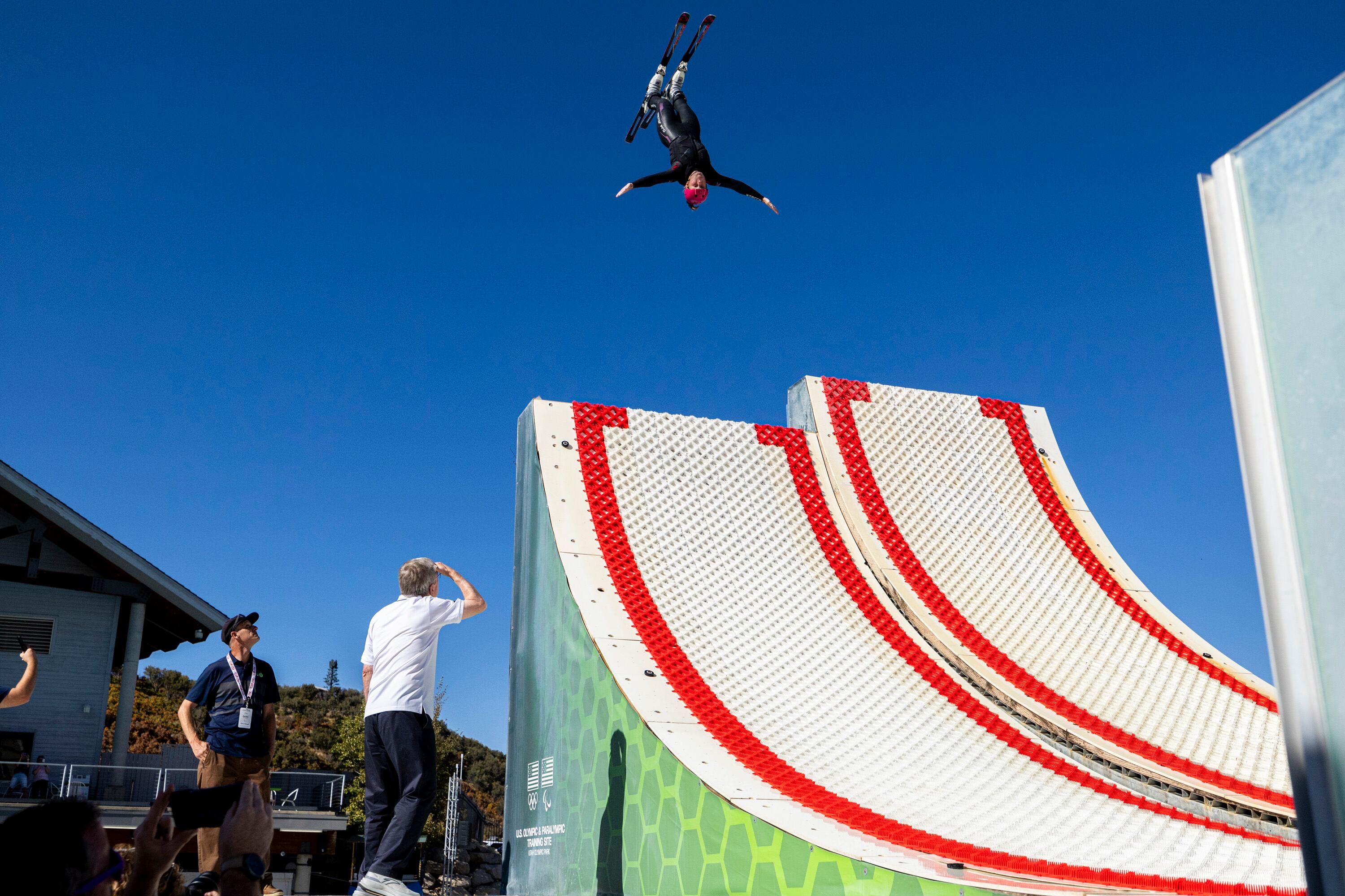 International Olympic Committee President Thomas Bach watches an athlete practice as he checks out the facilities at the Spence Eccles Olympic Freestyle Pool within the Utah Olympic Park in Park City on Saturday.