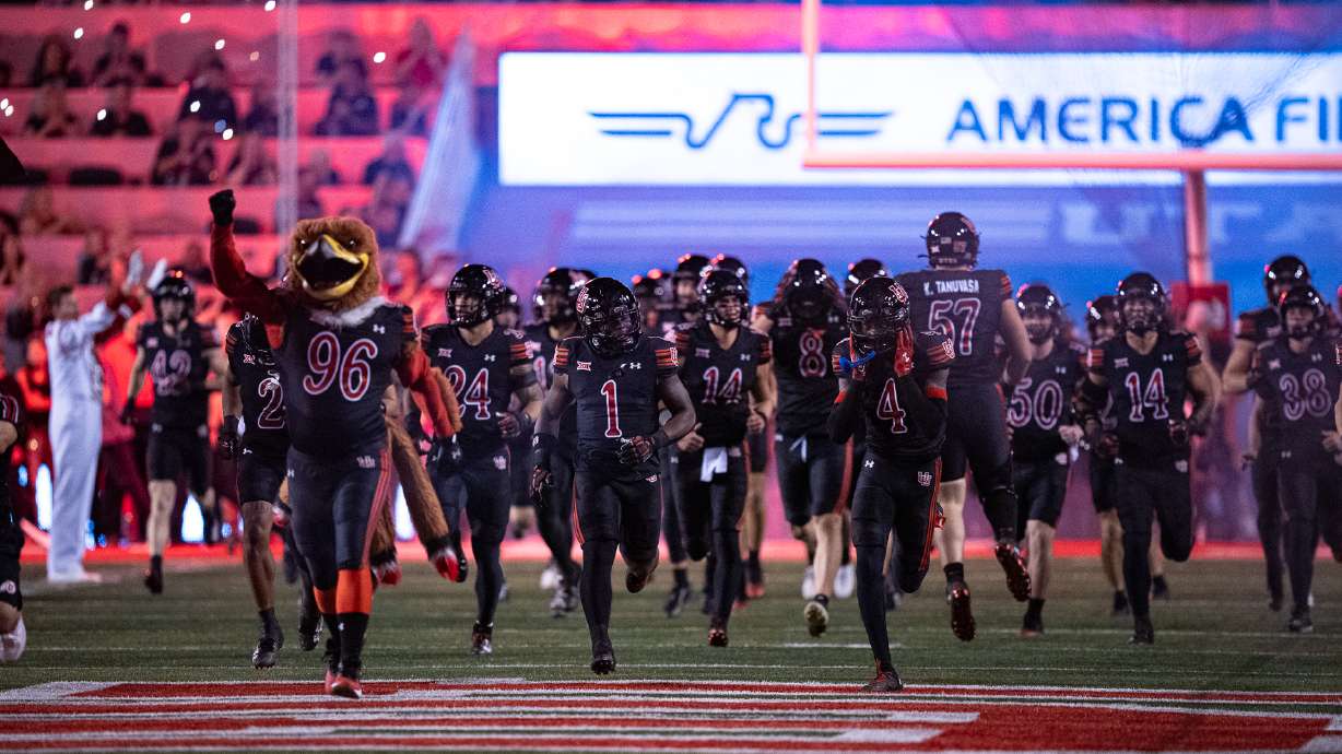 Utah players run onto the field before a game against Arizona at Rice-Eccles Stadium in Salt Lake City on Sept. 28, 2024.