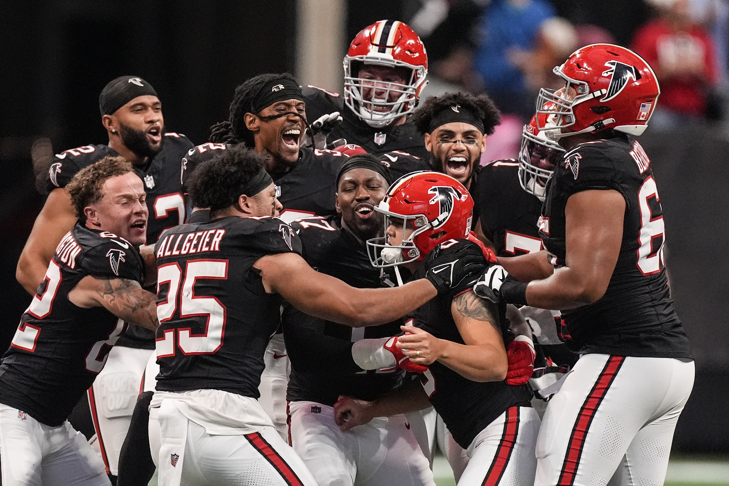 Atlanta Falcons players celebrate place kicker Younghoe Koo's game-winning 58-yard-field goal against the New Orleans Saints during the second half of an NFL football game, Sunday, Sept. 29, 2024, in Atlanta. 