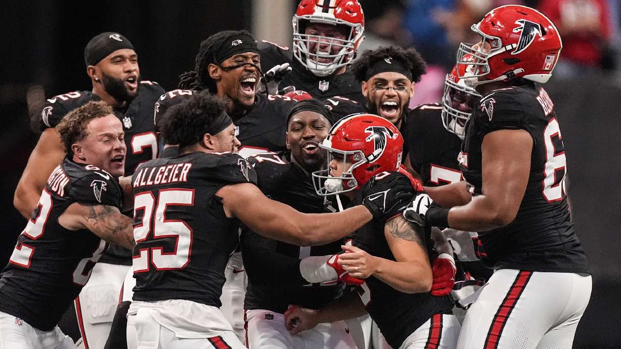 Atlanta Falcons players celebrate place kicker Younghoe Koo's game-winning 58-yard-field goal against the New Orleans Saints during the second half of an NFL football game, Sunday, Sept. 29, 2024, in Atlanta.