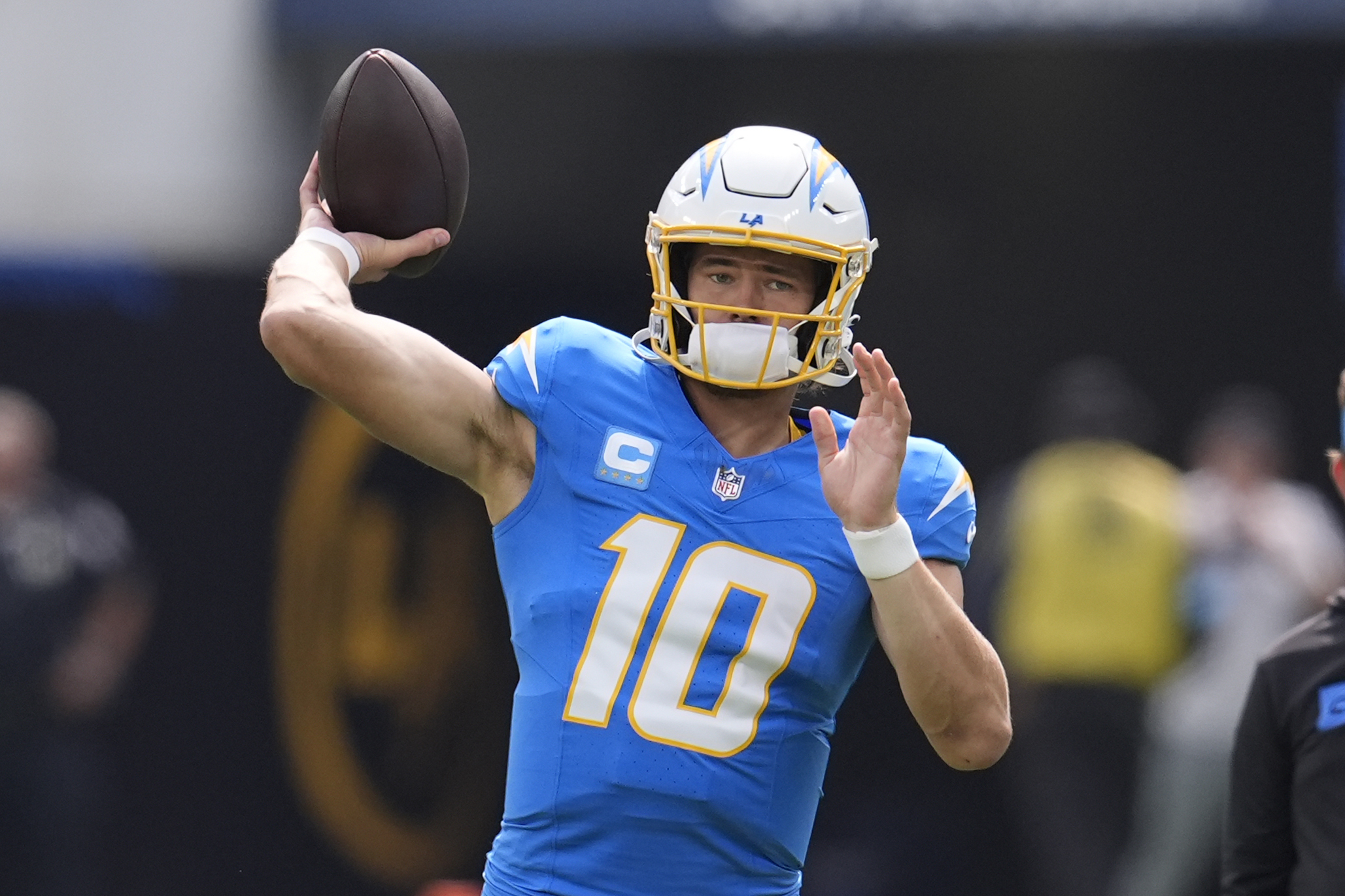 Los Angeles Chargers quarterback Justin Herbert warms up before the start of an NFL football game against the Kansas City Chiefs Sunday, Sept. 29, 2024, in Inglewood, Calif. 