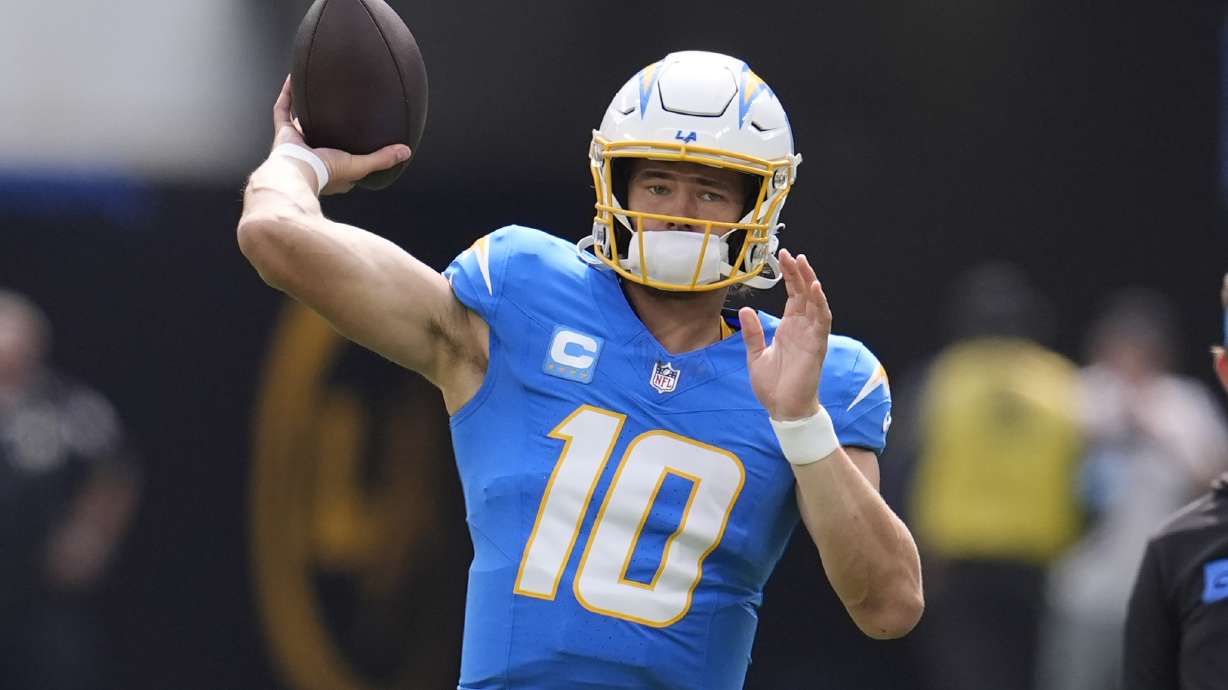Los Angeles Chargers quarterback Justin Herbert warms up before the start of an NFL football game against the Kansas City Chiefs Sunday, Sept. 29, 2024, in Inglewood, Calif.