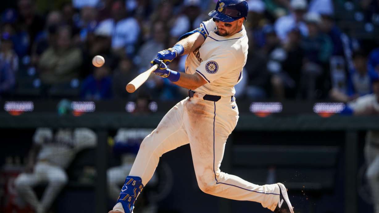 Seattle Mariners' Cal Raleigh hits a two-run home run against the Oakland Athletics during the fifth inning of a baseball game, Sunday, Sept. 29, 2024, in Seattle.