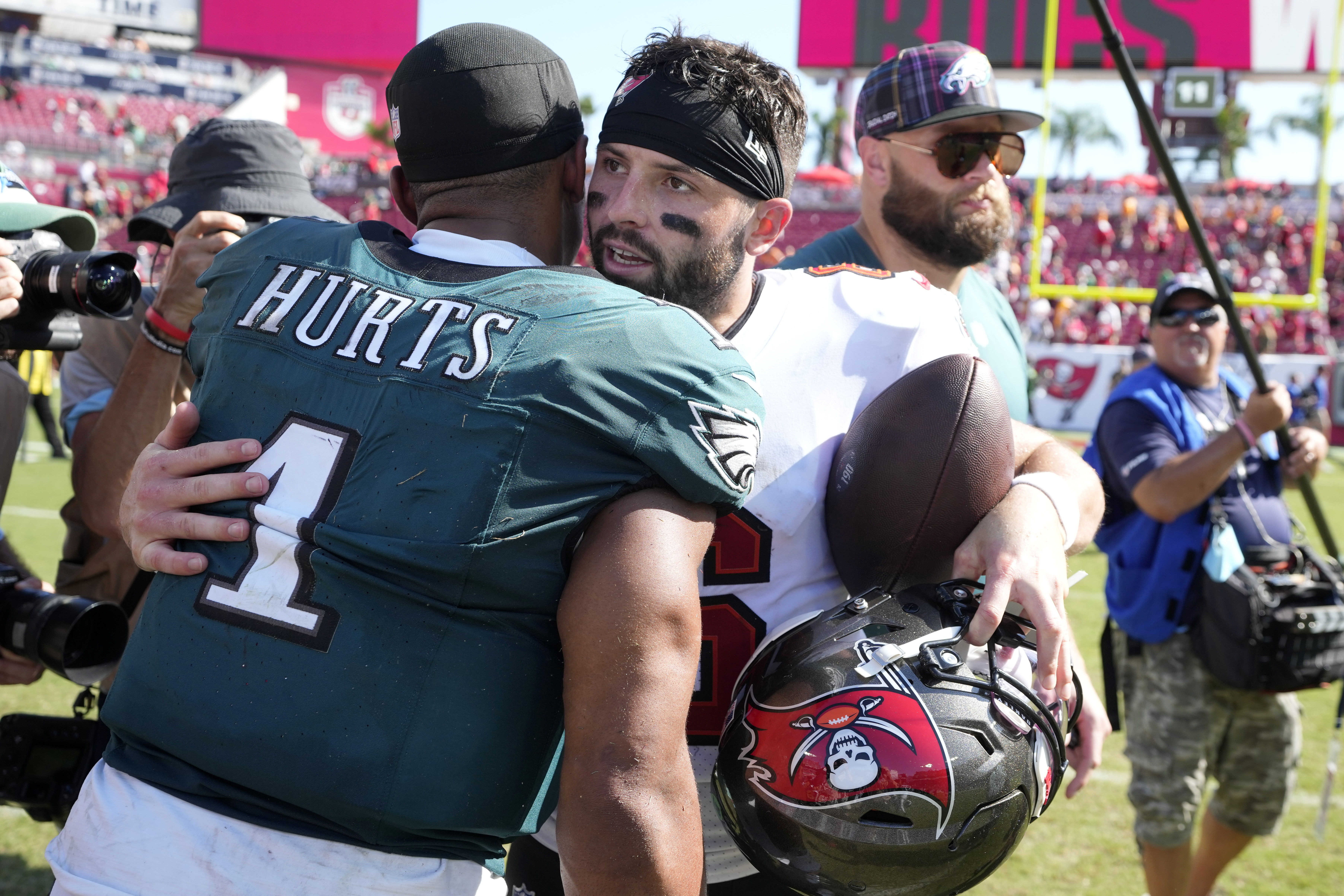 Tampa Bay Buccaneers' Baker Mayfield, right, and Philadelphia Eagles' Jalen Hurts meet after an NFL football game, Sunday, Sept. 29, 2024, in Tampa, Fla. 