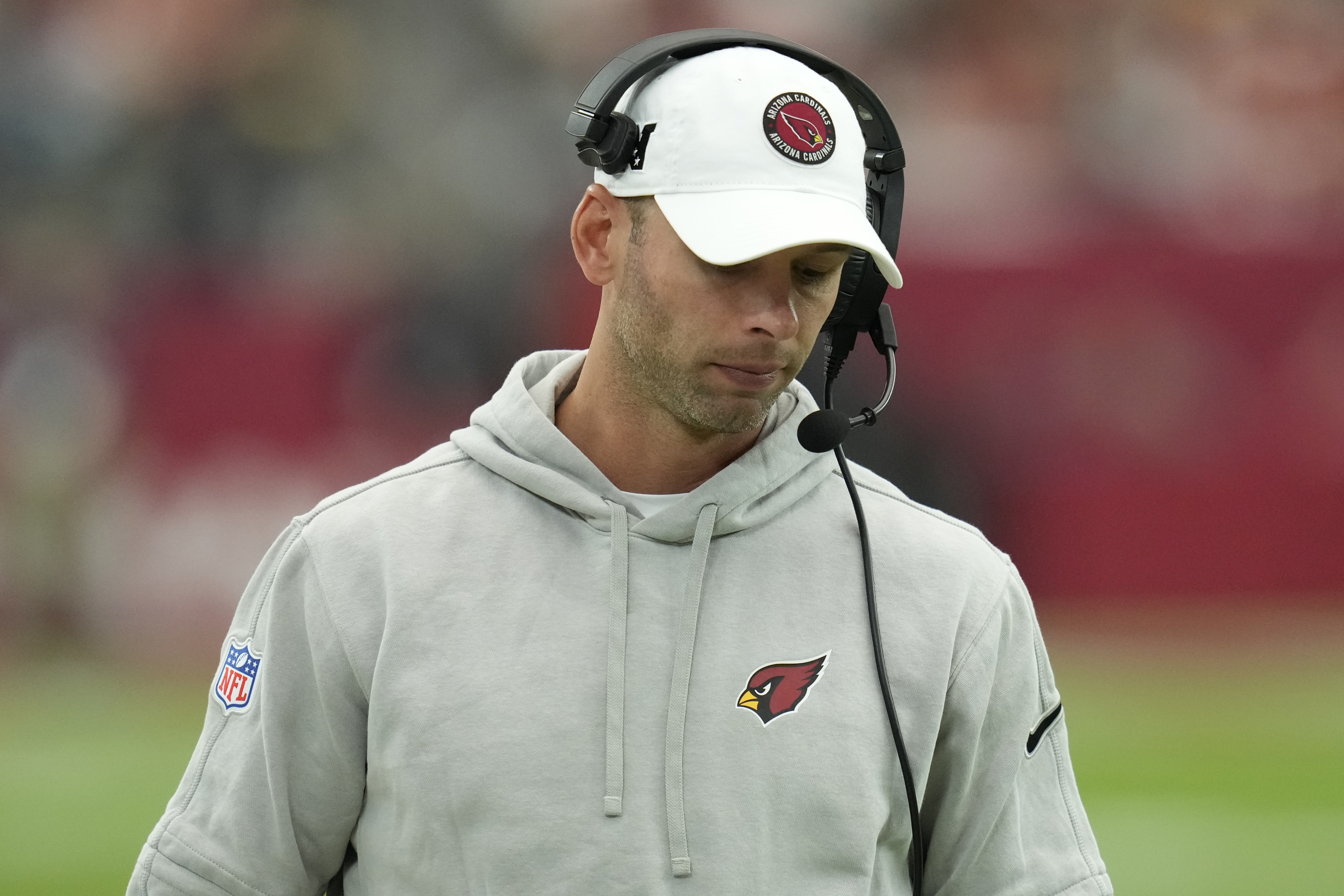 Arizona Cardinals head coach Jonathan Gannon walks the sidelines during the first half of an NFL football game against the Washington Commanders, Sunday, Sept. 29, 2024, in Glendale, Ariz.