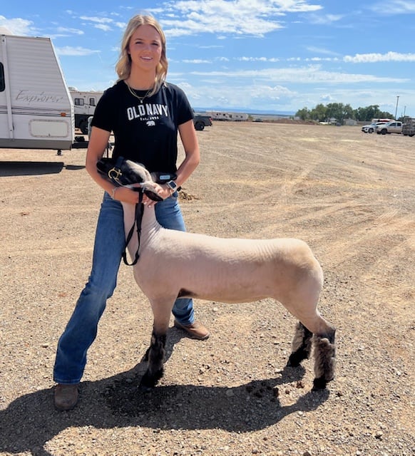 Monticello teenager Alise Lewis is pictured with her lamb in an undated photo.