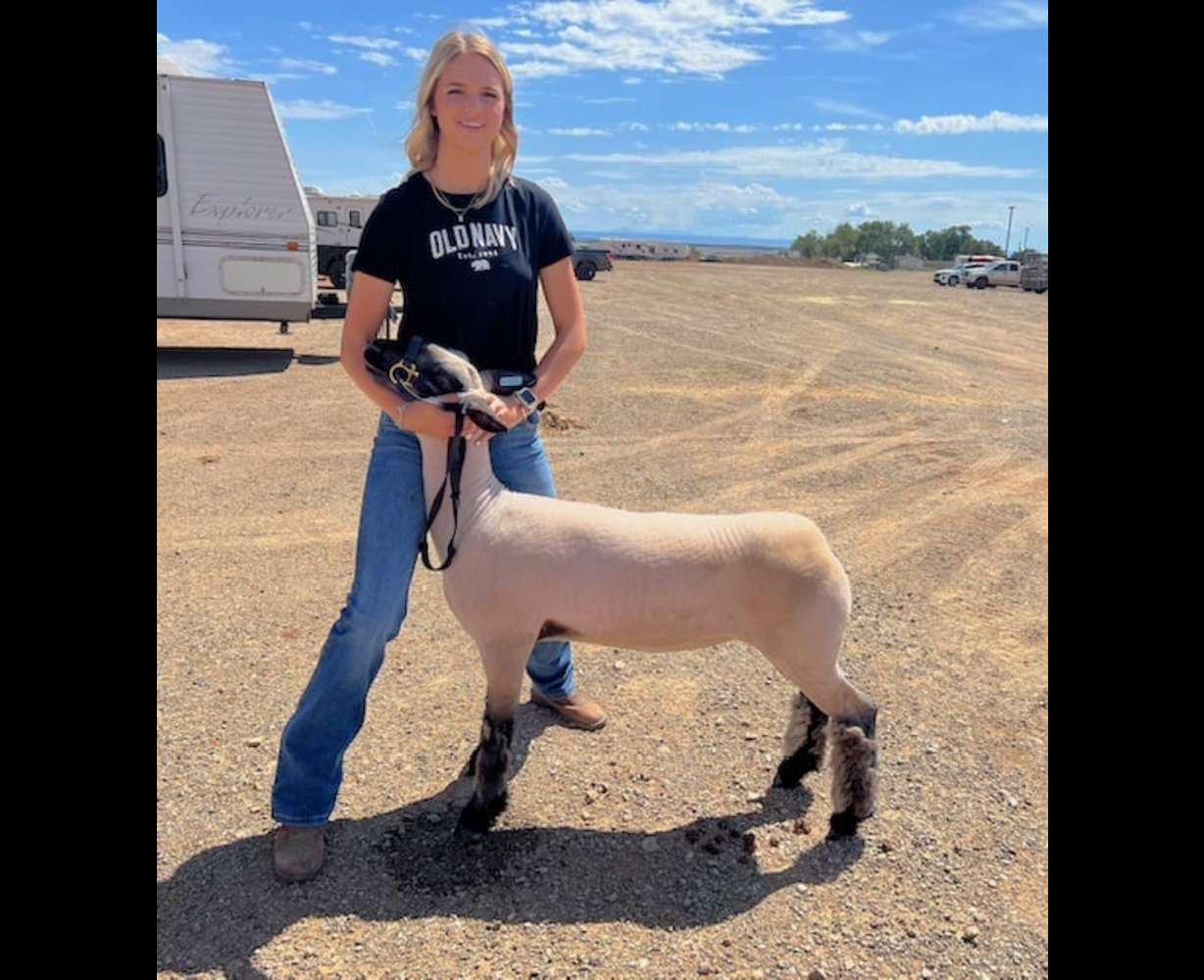 Monticello teenager Alise Lewis is pictured with her lamb in an undated photo.