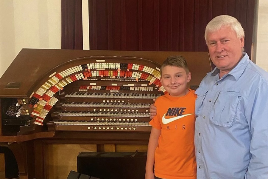 Kobin Harris is with his organ teacher Jim Clark. Harris picked up organ lessons as he recovered from brain surgery and today the accomplished 11-year-old frequently performs music. 