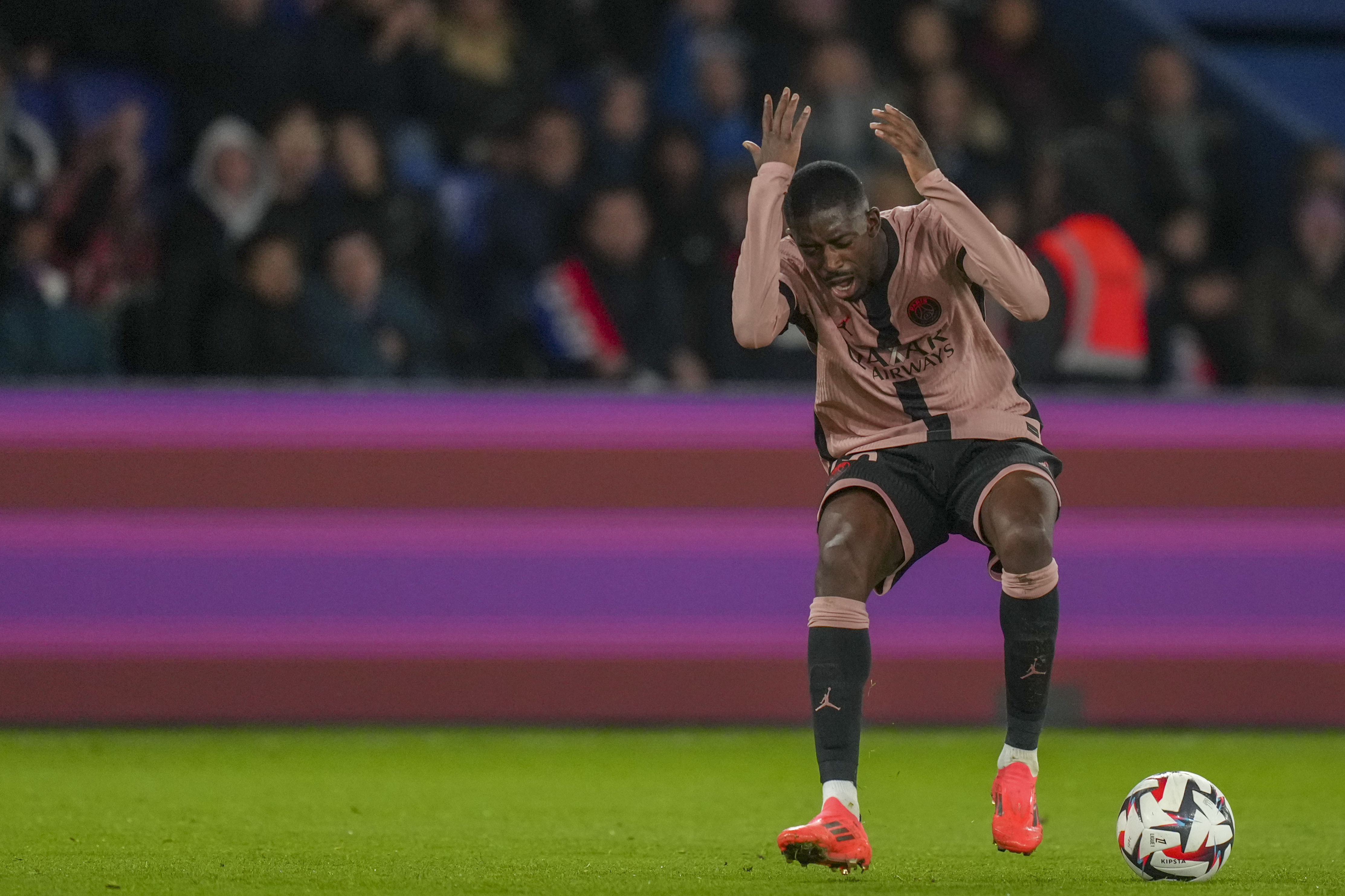 PSG's Ousmane Dembele reacts during the French League One soccer match between Paris Saint-Germain and Rennes at the Parc des Princes in Paris, Friday, Sept. 27, 2024. 
