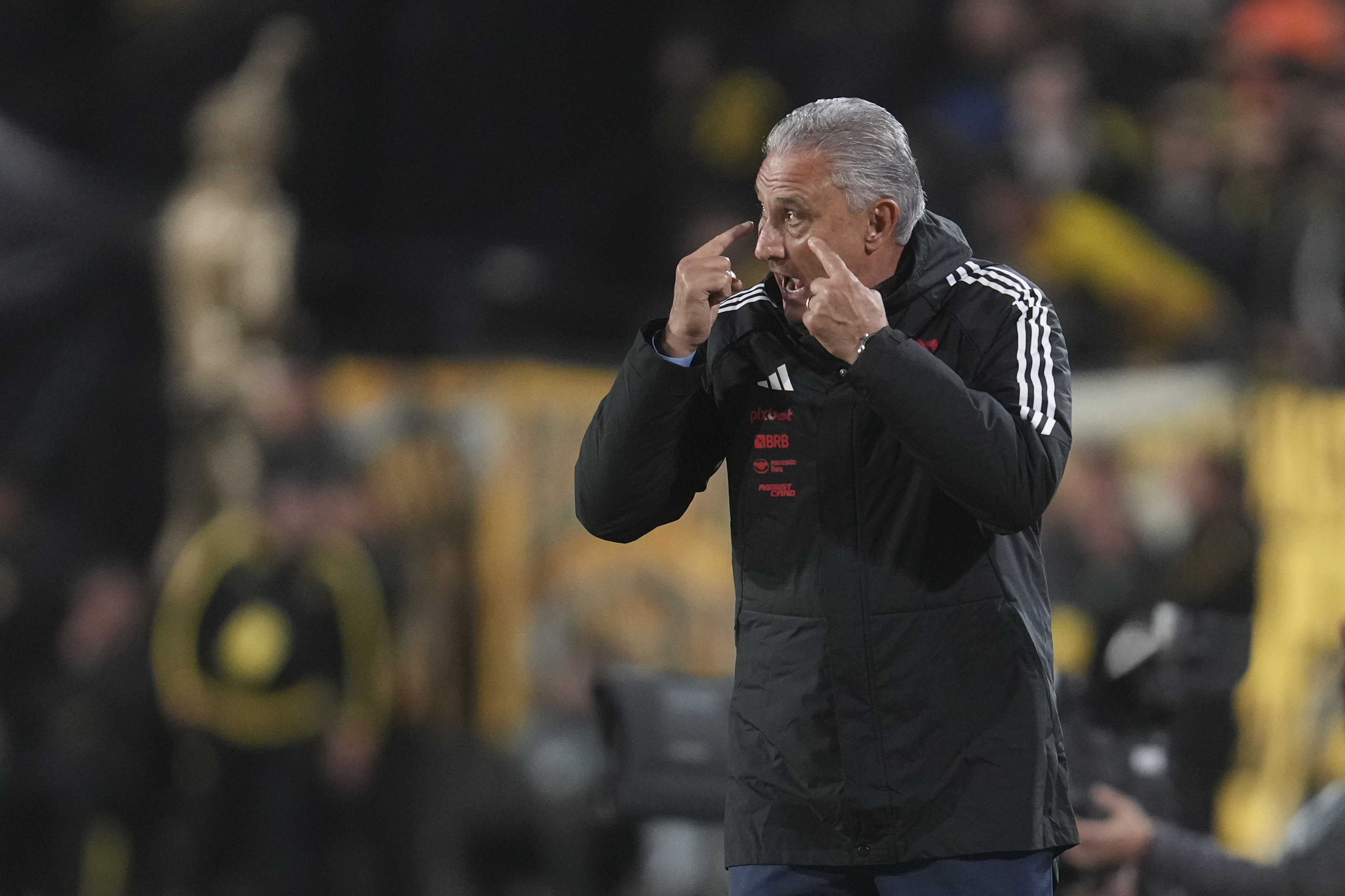 Coach Tite of Brazil's Flamengo instructs his players during a Copa Libertadores quarter final second leg soccer match against Uruguay's Penarol at Campeon del Siglo Stadium in Montevideo, Uruguay, Thursday, Sept. 26, 2024. 