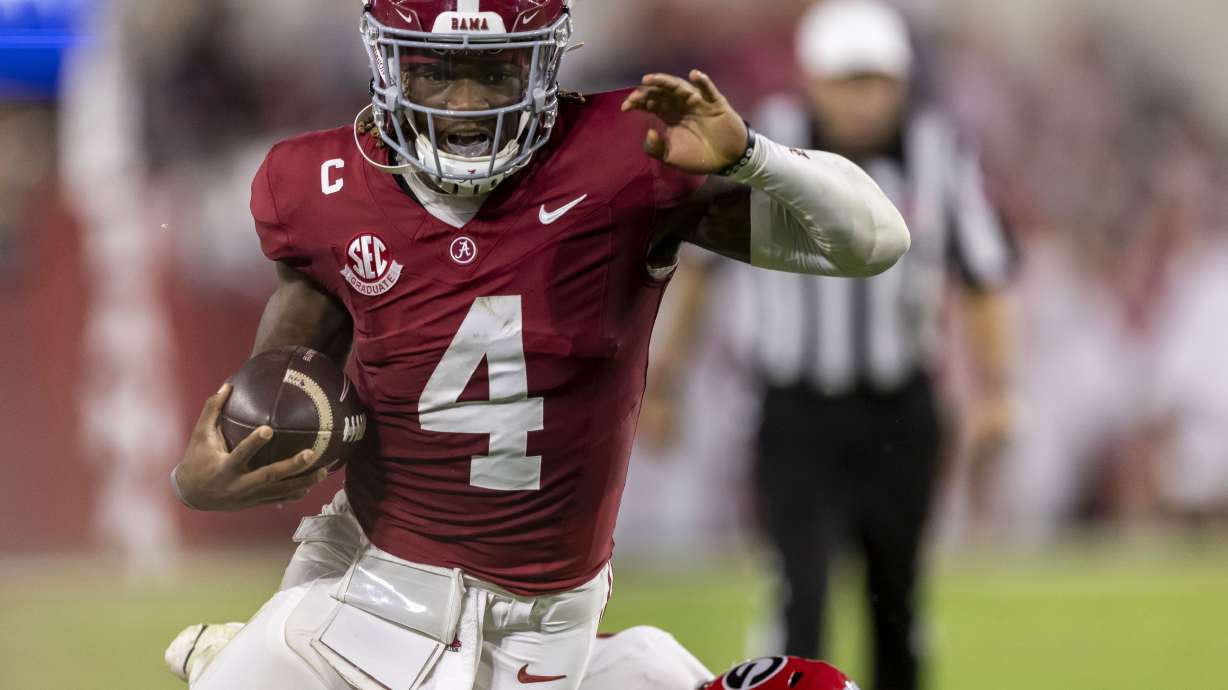 Alabama quarterback Jalen Milroe runs the ball for a touchdown against Georgia during the first half of an NCAA college football game, Saturday, Sept. 28, 2024, in Tuscaloosa, Ala.
