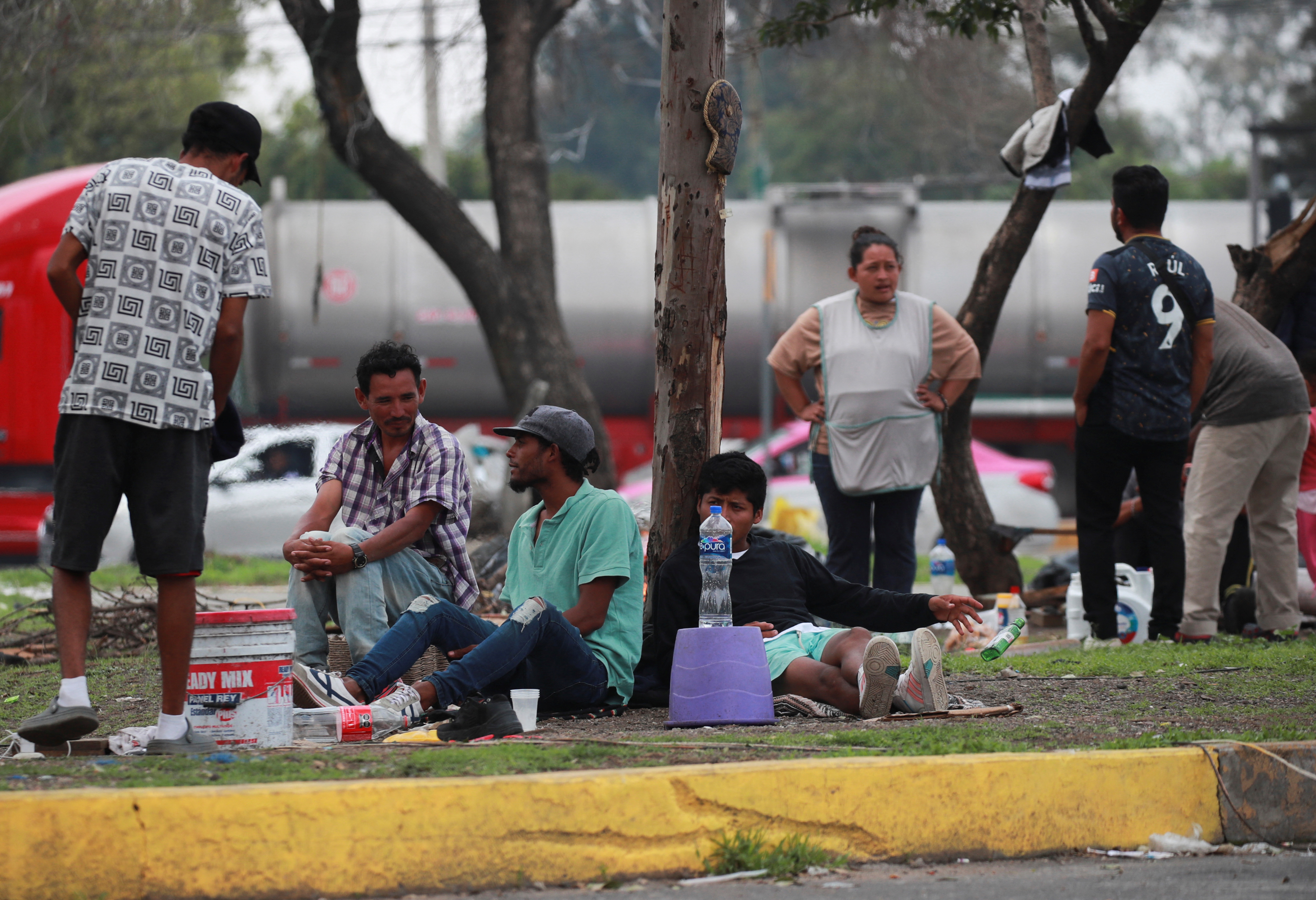 Migrants, mostly from Venezuela rest near a makeshift camp near the North Bus Station in Mexico City, Mexico, July 24. A group of Utahns came together over the weekend for an experiment in getting along by talking about immigration.