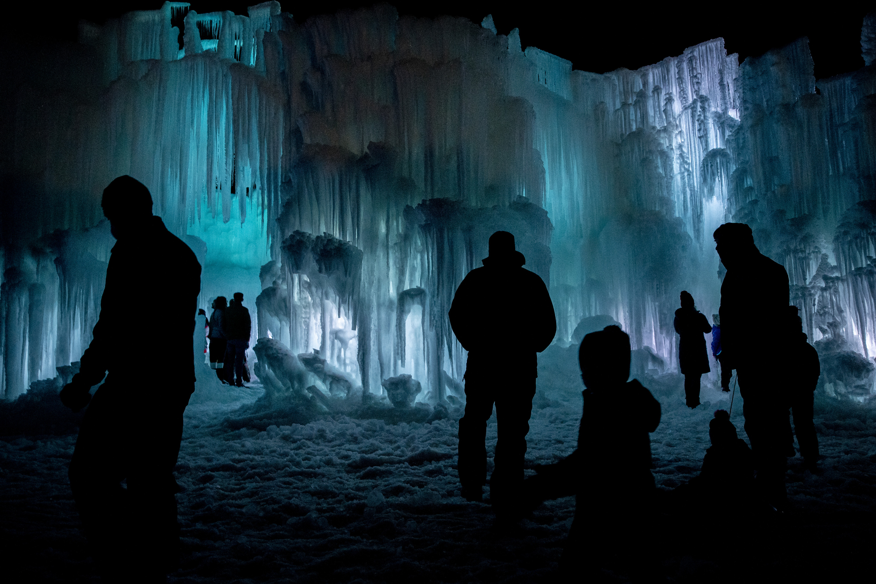 People explore the Midway Ice Castles in Midway on Jan. 14, 2022. Ice Castles announced its plans for the winter attraction this year on Monday, including a new nightly fire show display.