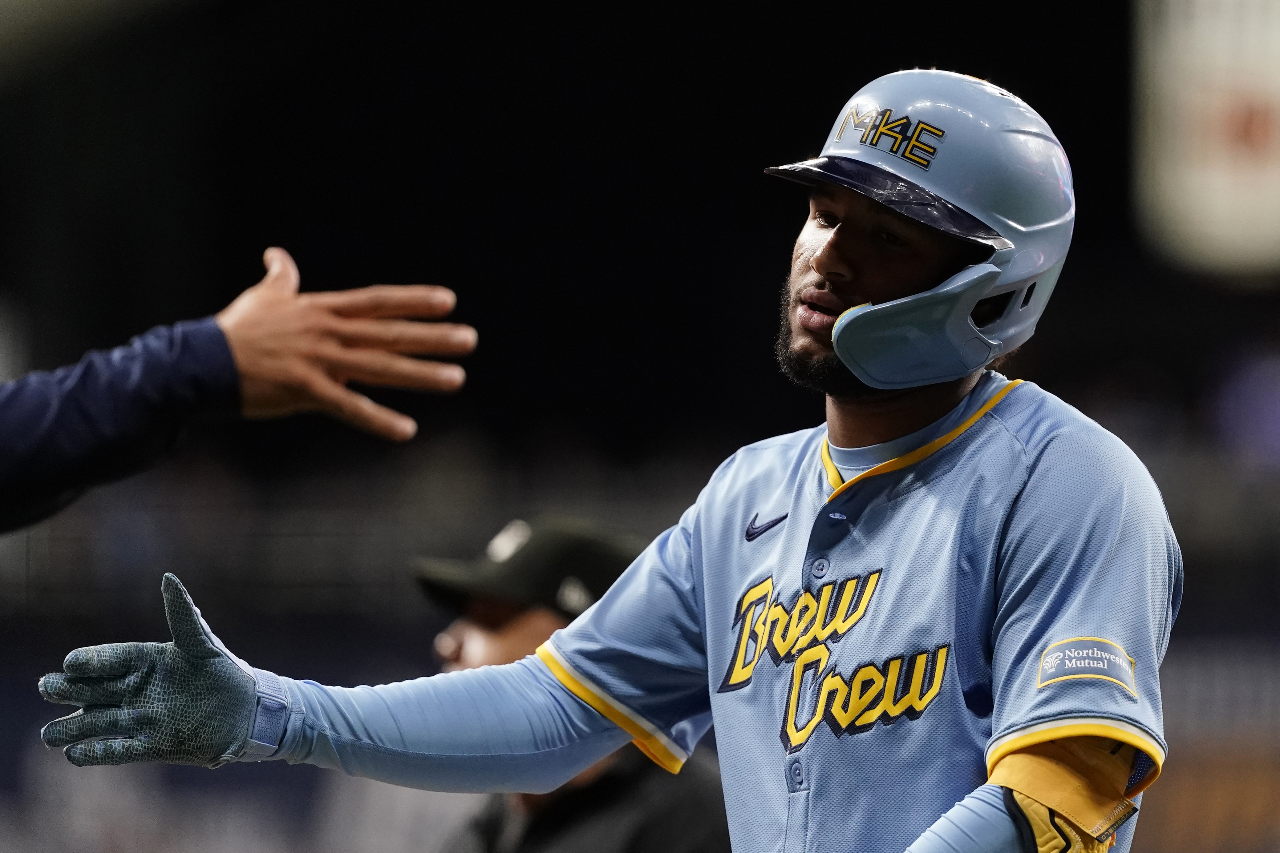 Milwaukee Brewers' Jackson Chourio is congratulated after hitting an RBI single during the fourth inning of a baseball game against the New York Mets, Friday, Sept. 27, 2024, in Milwaukee. 