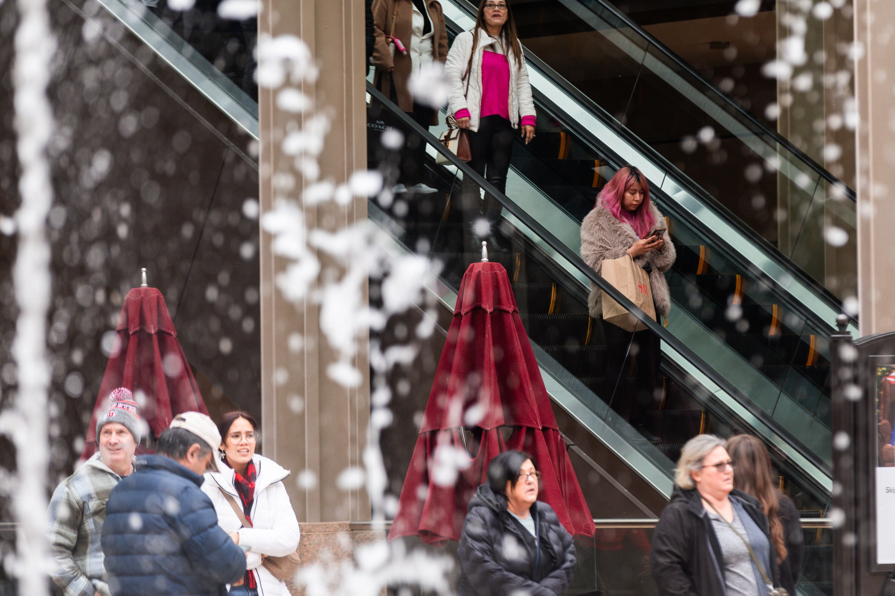 Shoppers are pictured on Black Friday at City Creek Center in Salt Lake City on Nov. 24, 2023. Retail industry watchers say this year’s winter holiday shopping season is shaping up to smash previous spending records.