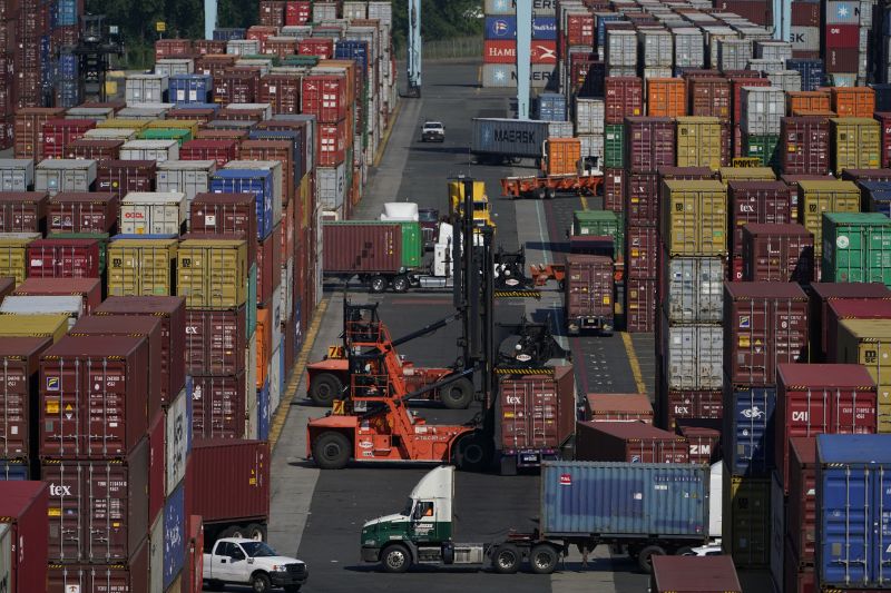 Containers are moved at the Port of New York and New Jersey in Elizabeth, N.J., on June 30, 2021.