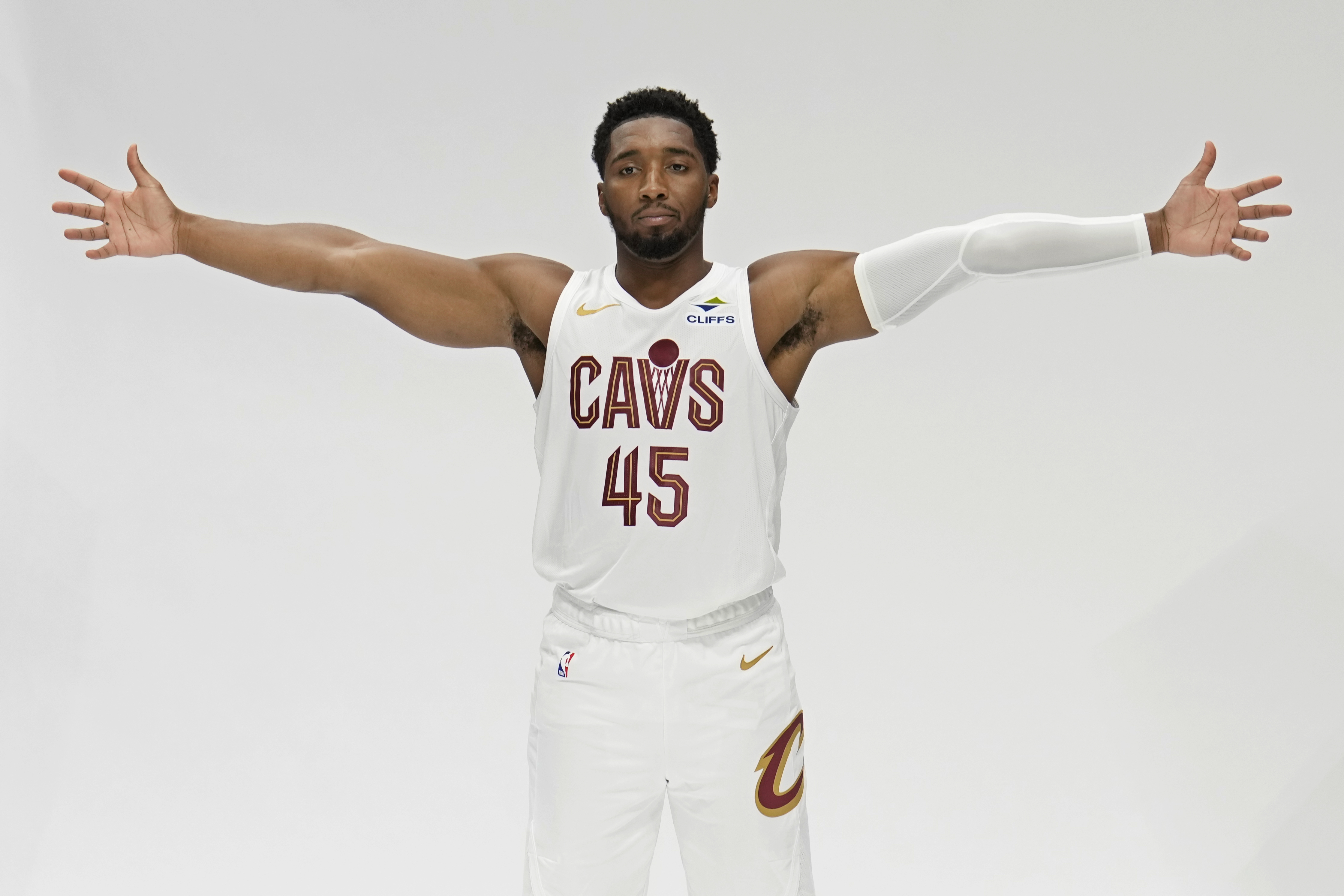 Cleveland Cavaliers guard Donovan Mitchell shows his wingspan during an NBA basketball media day, Monday, Sept. 30, 2024, in Cleveland. 