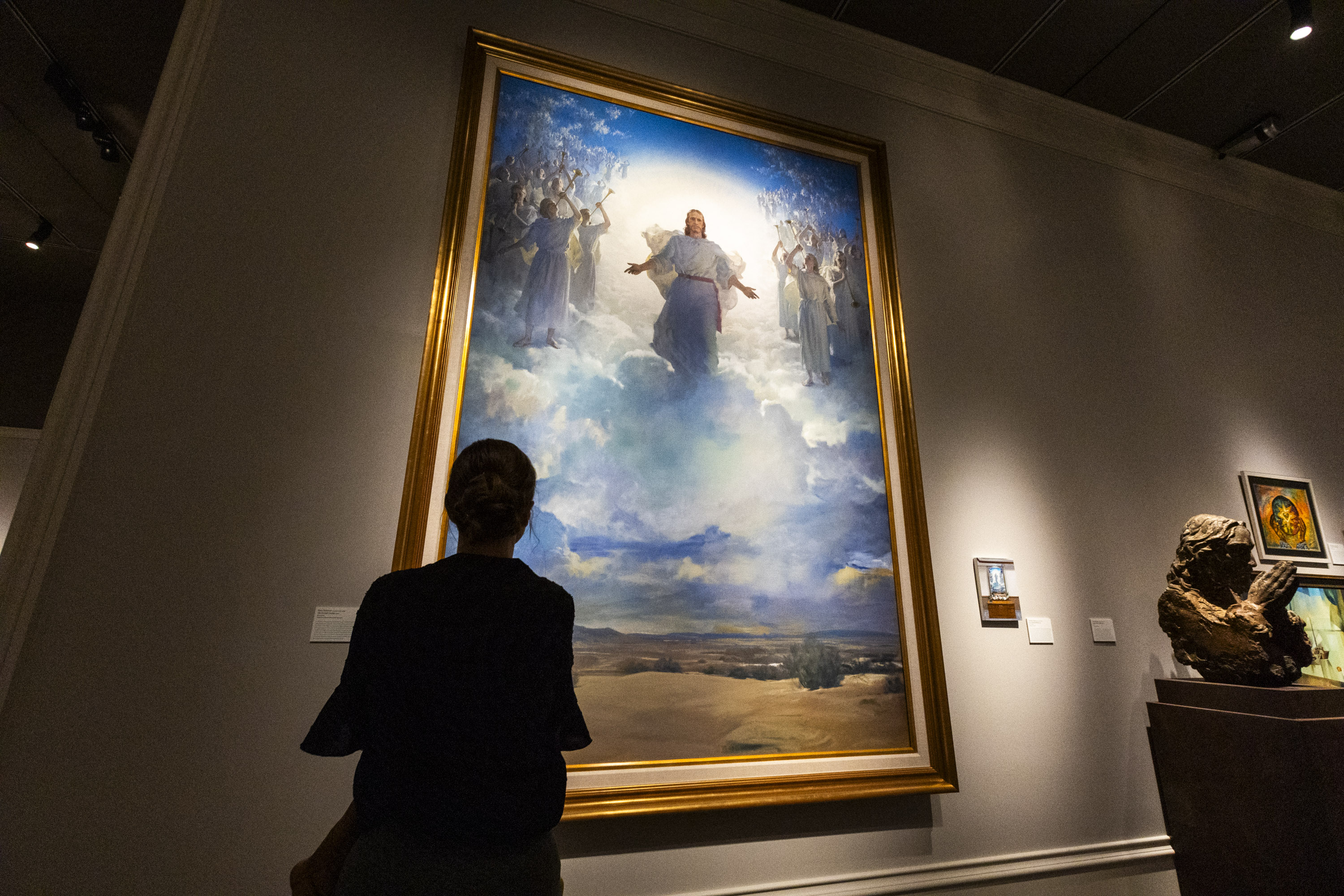 Kyra Sutherland views Harry Anderson’s “The Second Coming” at an exhibition organized by the Church History Museum and the Center for Latter-day Saint Arts featuring art created by, for and about Latter-day Saints between 1830 and the present.