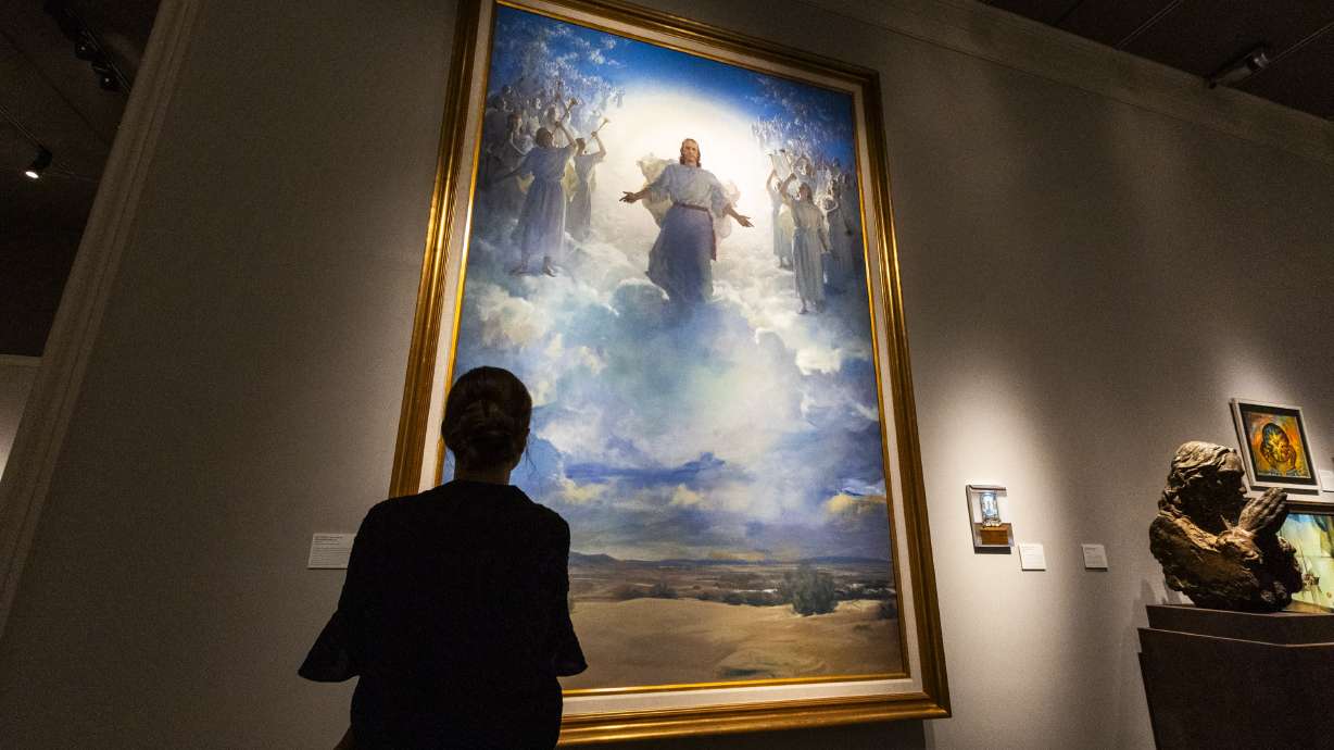 Kyra Sutherland views Harry Anderson’s “The Second Coming” at an exhibition organized by the Church History Museum and the Center for Latter-day Saint Arts featuring art created by, for and about Latter-day Saints between 1830 and the present.