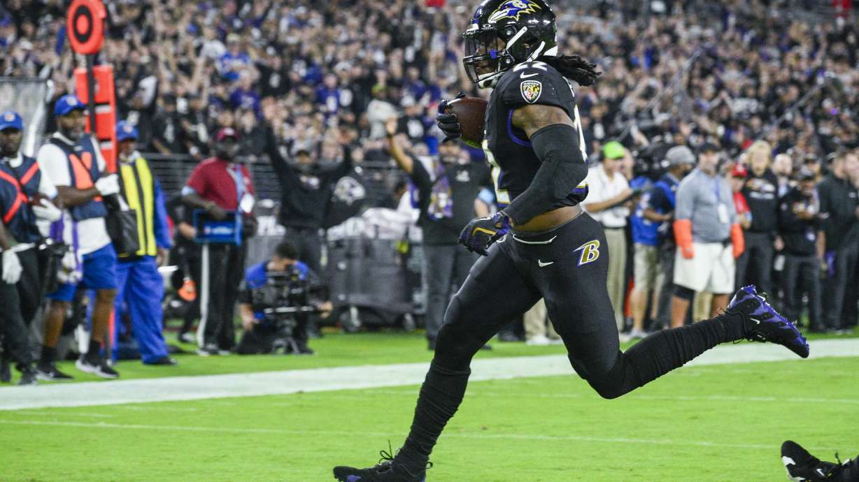 Baltimore Ravens running back Derrick Henry runs for a touchdown after catching a pass from quarterback Lamar Jackson against the Buffalo Bills during the first half of an NFL football game, Sunday, Sept. 29, 2024, in Baltimore.