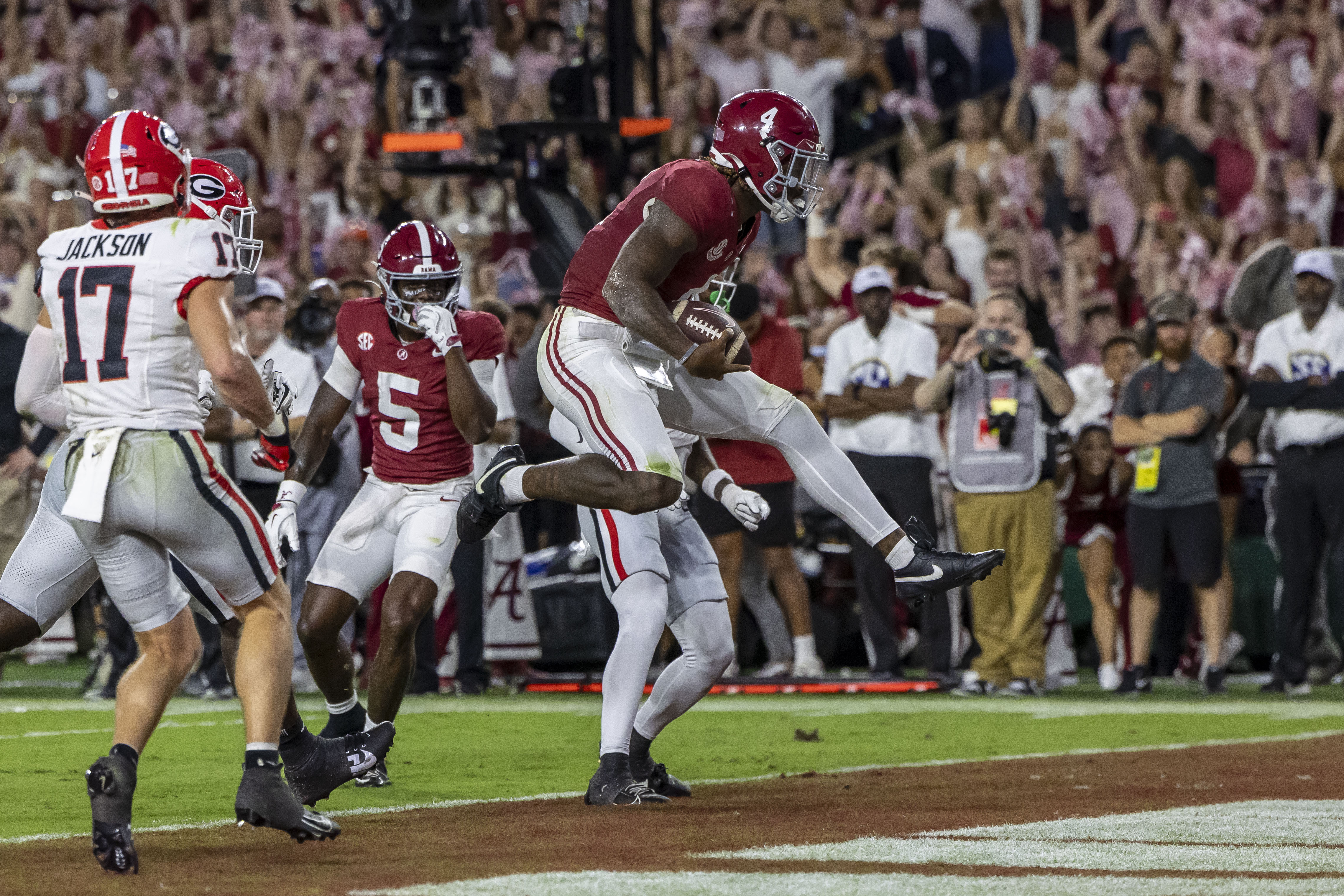 Alabama quarterback Jalen Milroe (4) scores on a running play against Georgia during the first half of an NCAA college football game, Saturday, Sept. 28, 2024, in Tuscaloosa, Ala. 