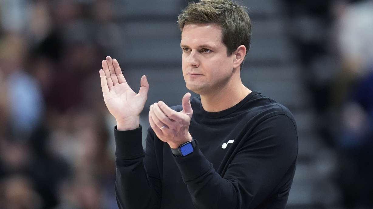 FILE - Utah Jazz coach Will Hardy applauds during the second half of the team's NBA basketball game against the Houston Rockets, April 11, 2024, in Salt Lake City.