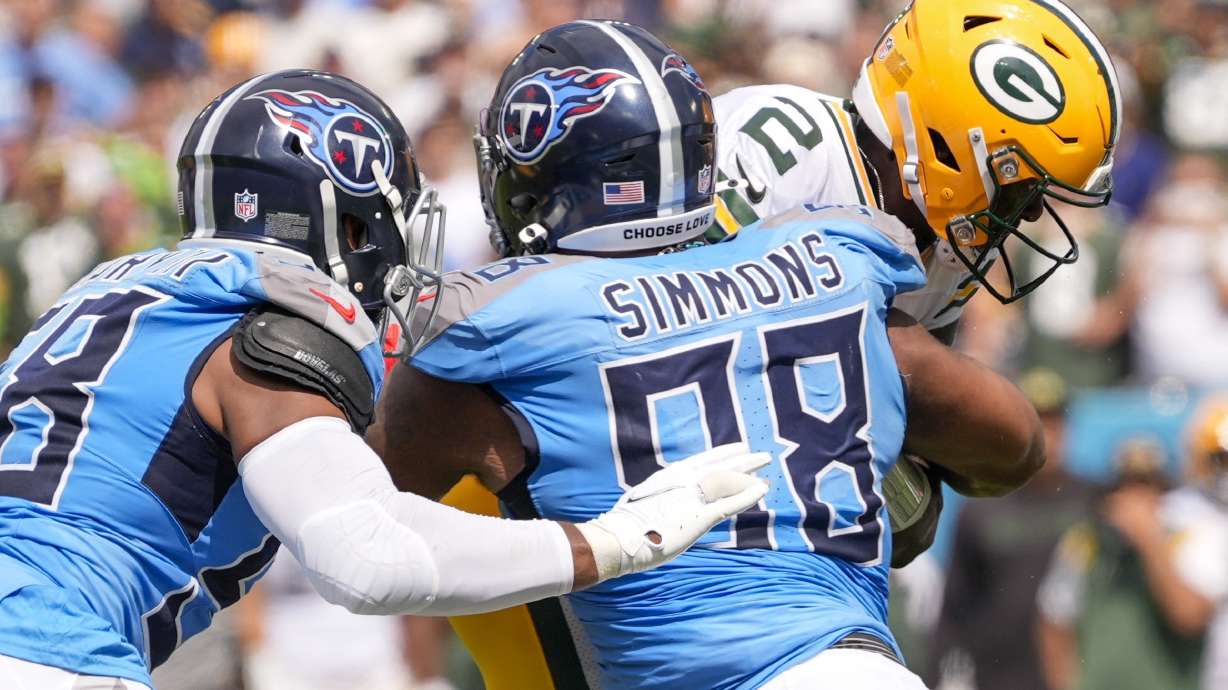 Green Bay Packers' Malik Willis is sacked by Tennessee Titans' Jeffery Simmons during the first half of an NFL football game Sunday, Sept. 22, 2024, in Nashville, Tenn.
