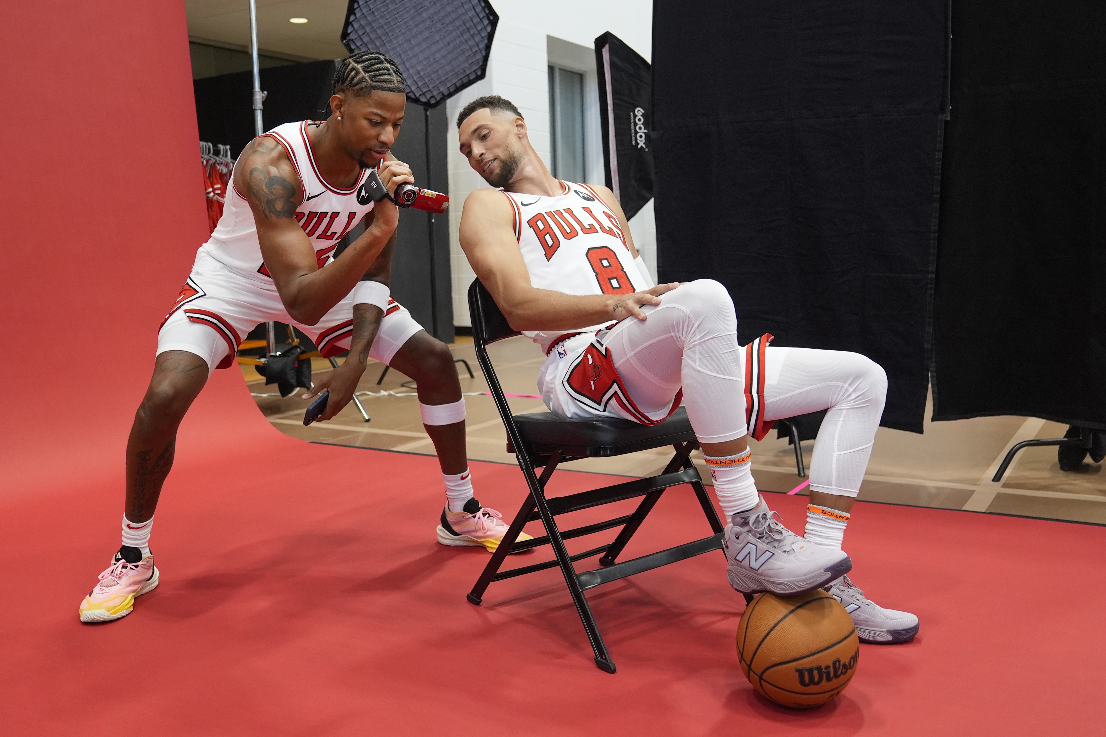 Chicago Bulls forward Dalen Terry, left, and guard Zach LaVine look at Terry's video during the team's media day Monday, Sept. 30, 2024, in Chicago. 