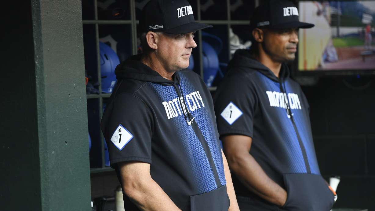 Detroit Tigers manager A.J. Hinch, left, and bench coach George Lombard, right, watch from the dugout before a baseball game against the Baltimore Orioles, Friday, Sept. 13, 2024, in Detroit.