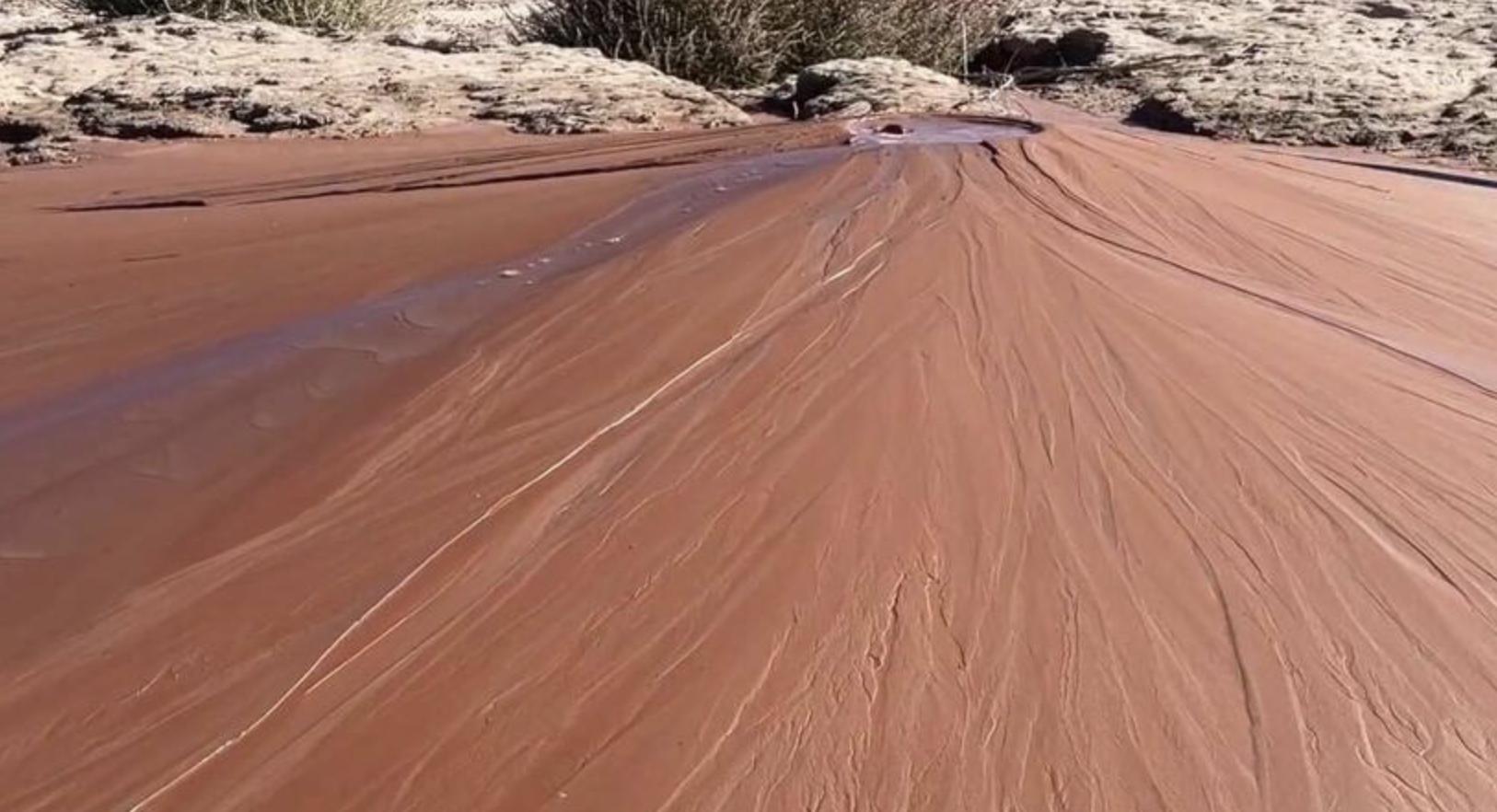 A mud volcano bubbles in White Canyon. At the confluence of White Canyon and the Colorado River, bubbling gas billows from a cone made of mud.