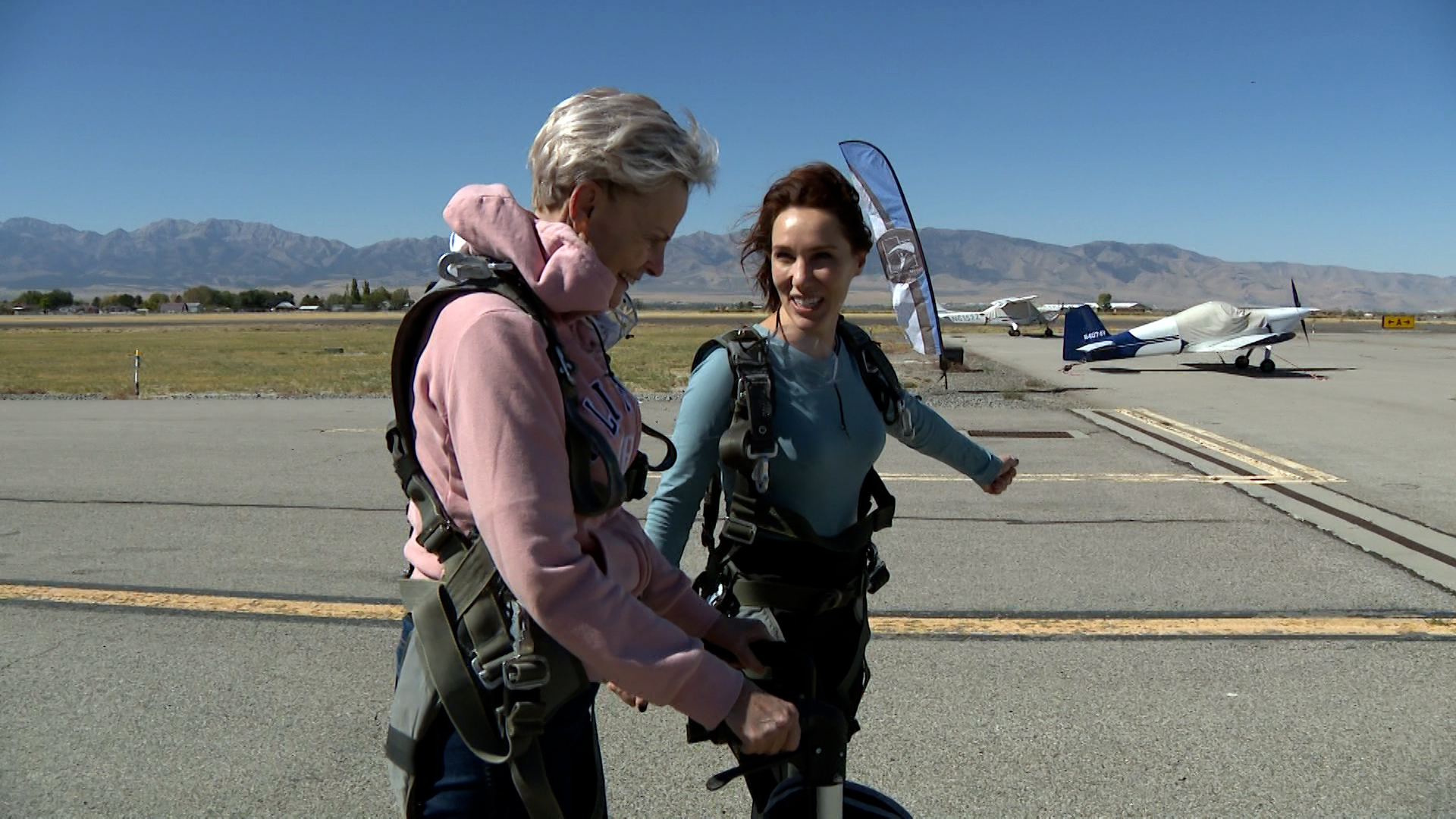 Burton and Blanch are all suited up and getting ready to enter the plane.