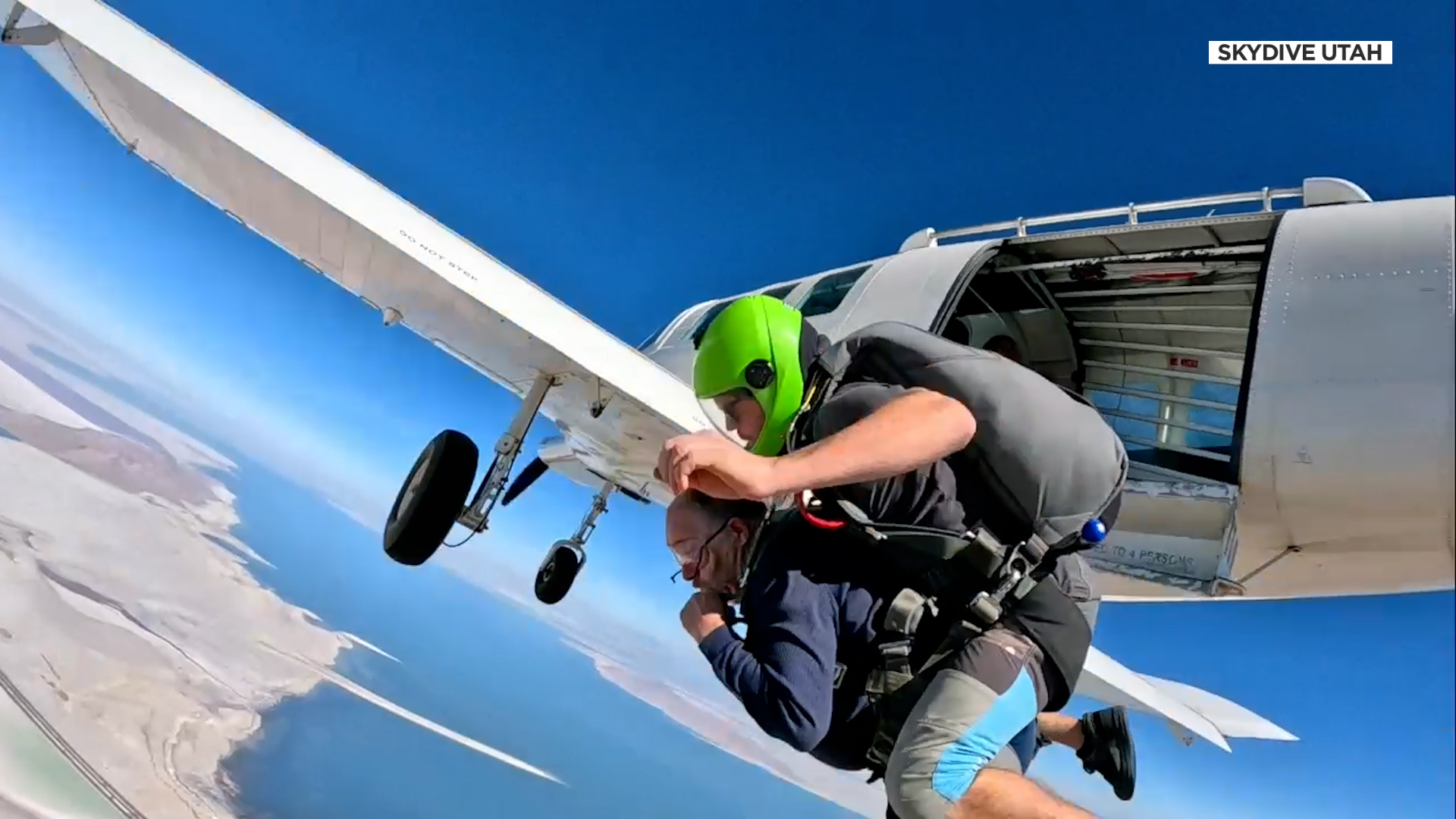 Thel Noyes jumps out of the plane with his instructor.