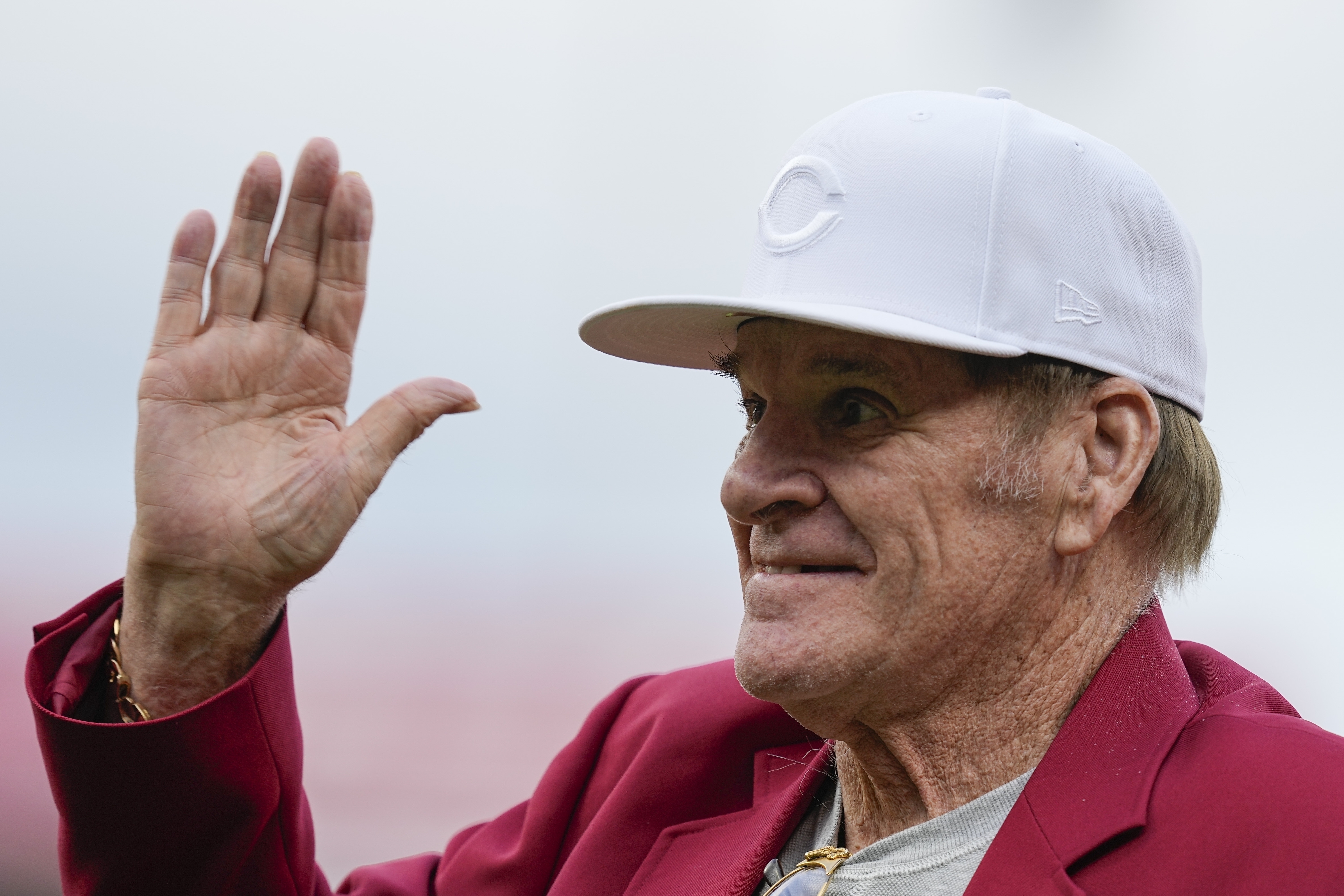 FILE - Former Cincinnati Reds player Pete Rose waves to fans after being introduced during the Reds Hall of Fame Induction Ceremony, July 15, 2023, in Cincinnati. 