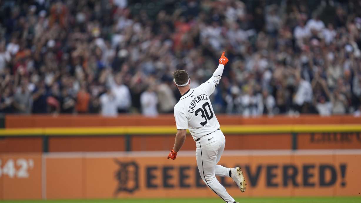 Detroit Tigers' Kerry Carpenter celebrates his grand slam against the Chicago White Sox in the fifth inning of a baseball game, Sunday, Sept. 29, 2024, in Detroit.