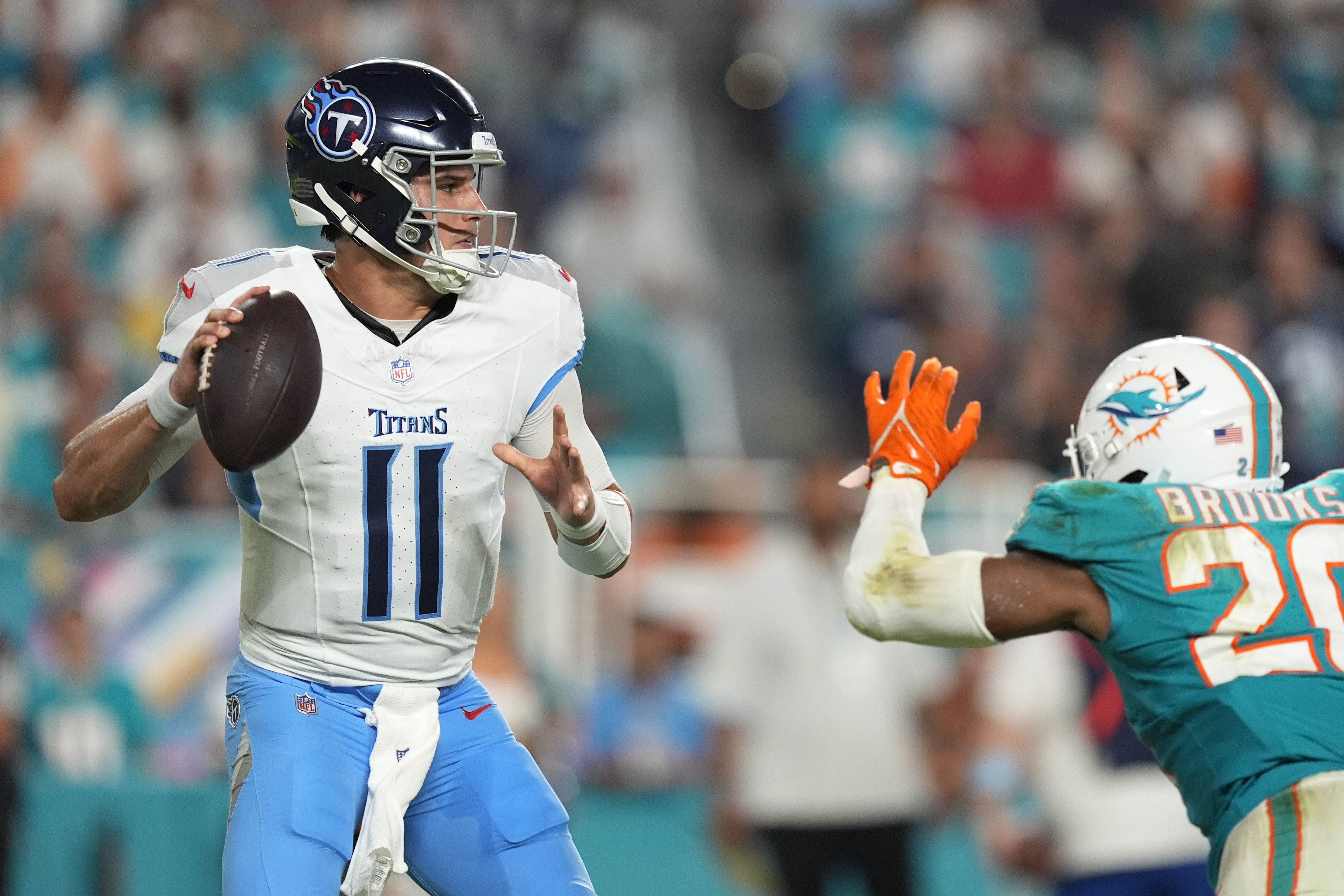 Tennessee Titans quarterback Mason Rudolph (11) aims a pass during the second half of an NFL football game against the Miami Dolphins, Monday, Sept. 30, 2024, in Miami Gardens, Fla. 
