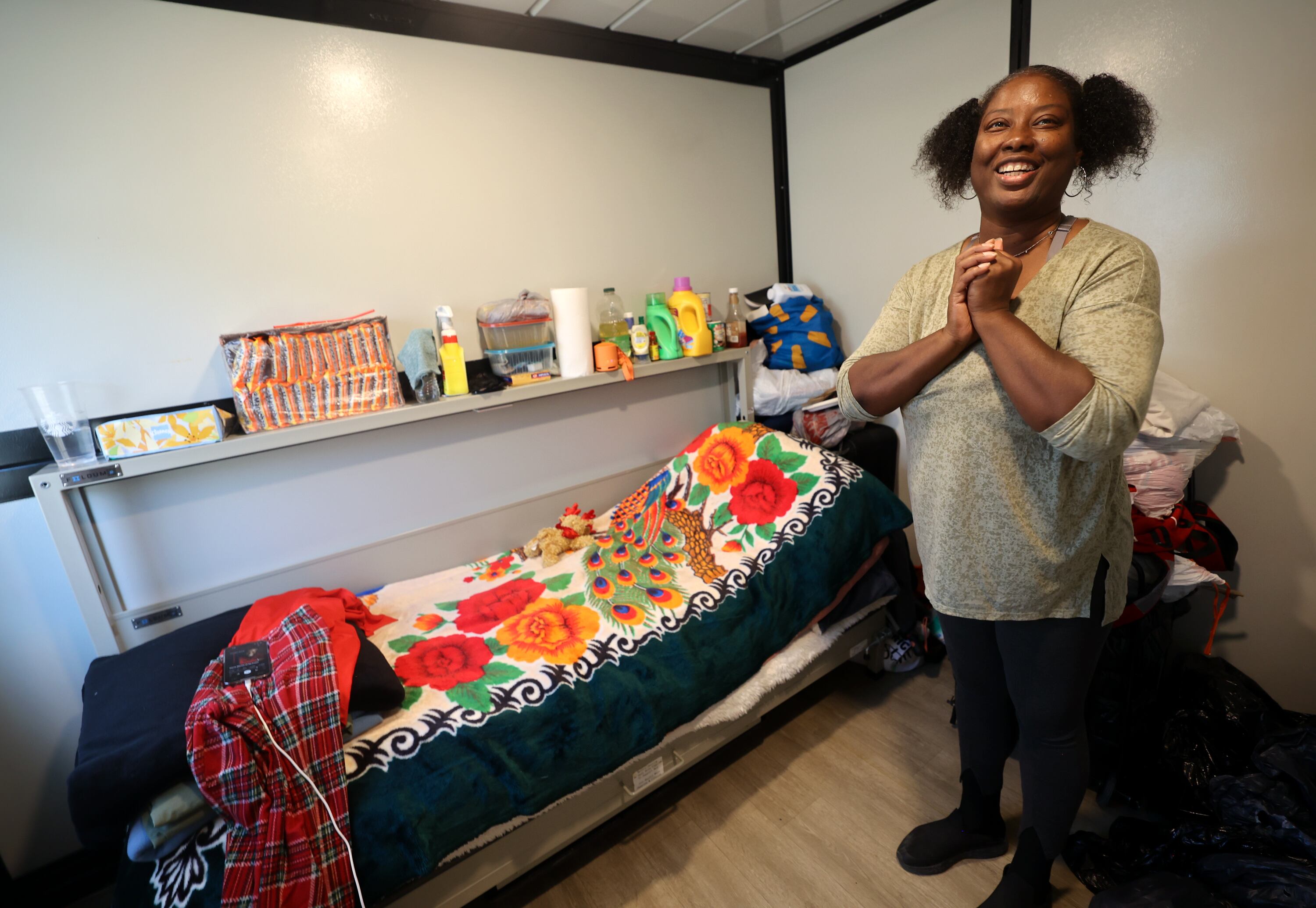 Ladonna Sidney, who has been homeless since April, discusses looking forward to a hot shower at the Microshelter Community, operated by Switchpoint, in Salt Lake City on Monday.