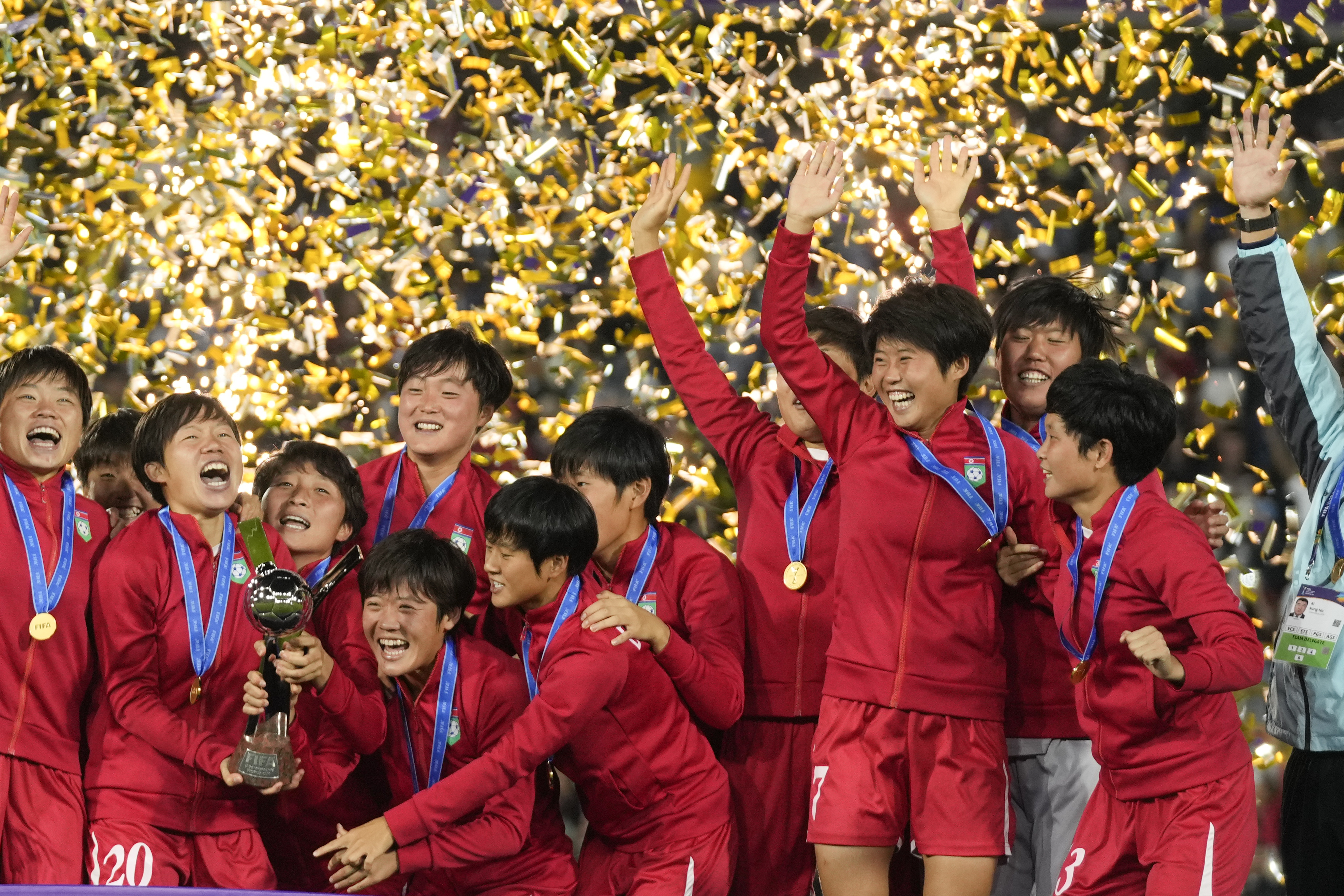 North Korean players celebrate with the trophy after winning the U-20 Women's World Cup final soccer match against Japan at El Campin stadium in Bogota, Colombia, Sunday, Sept. 22, 2024.