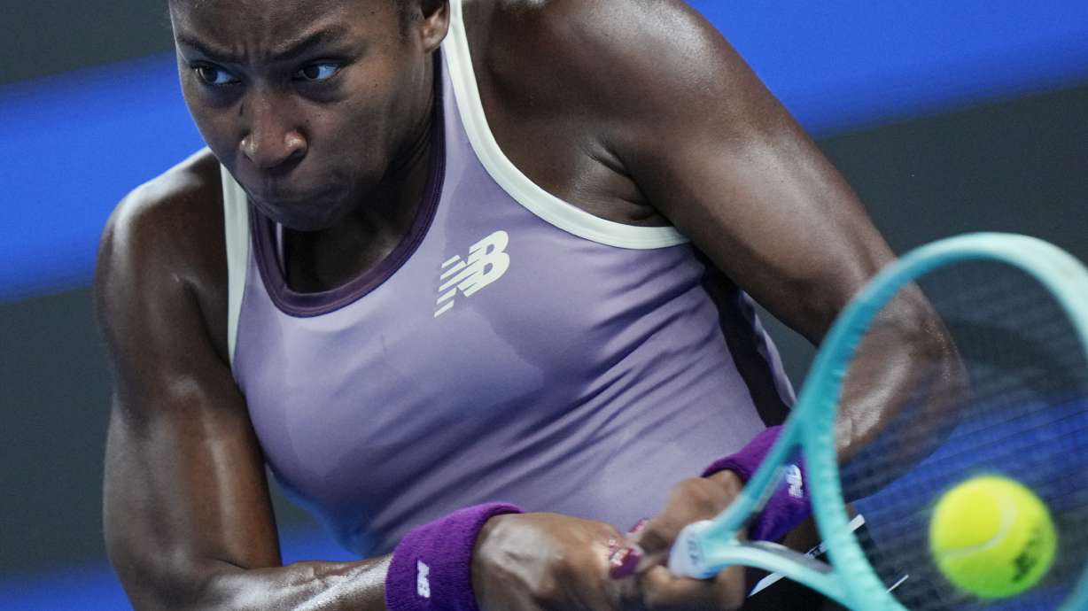 Coco Gauff of the United States returns a backhand shot to Katie Boulter of Great Britain during their women's singles match of the China Open tennis tournament, at the National Tennis Center in Beijing, Sunday, Sept. 29, 2024.