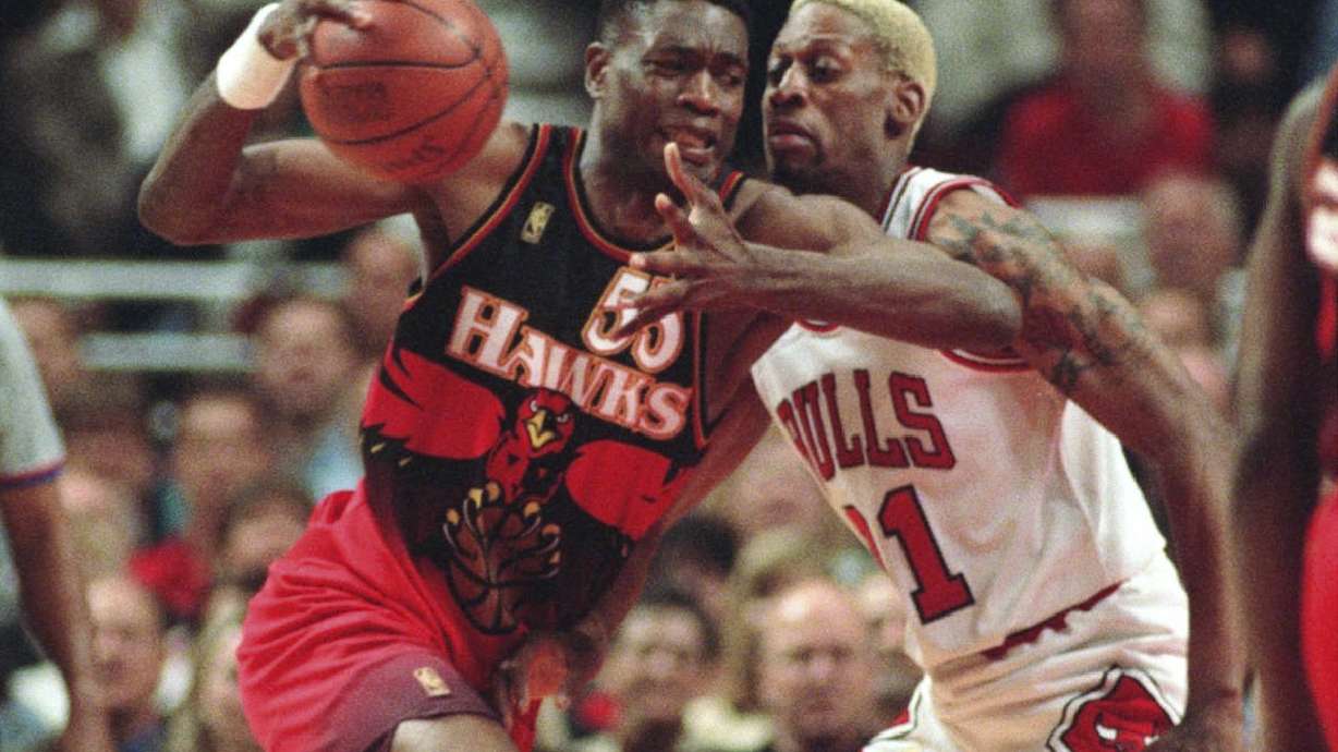 FILE - The Atlanta Hawks' Dikembe Mutombo, left, drives to the hoop against the Chicago Bulls' Dennis Rodman during the second quarter of their playoff game Thursday, May 8, 1997, in Chicago.