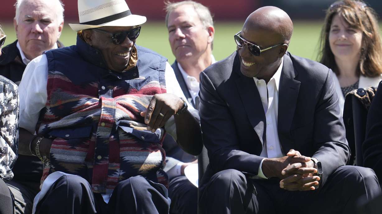 Dusty Baker, left, laughs with Barry Bonds during a ceremony for former San Francisco Giants player Orlando Cepeda before a baseball game between the Giants and the San Diego Padres in San Francisco, Sunday, Sept. 15, 2024.