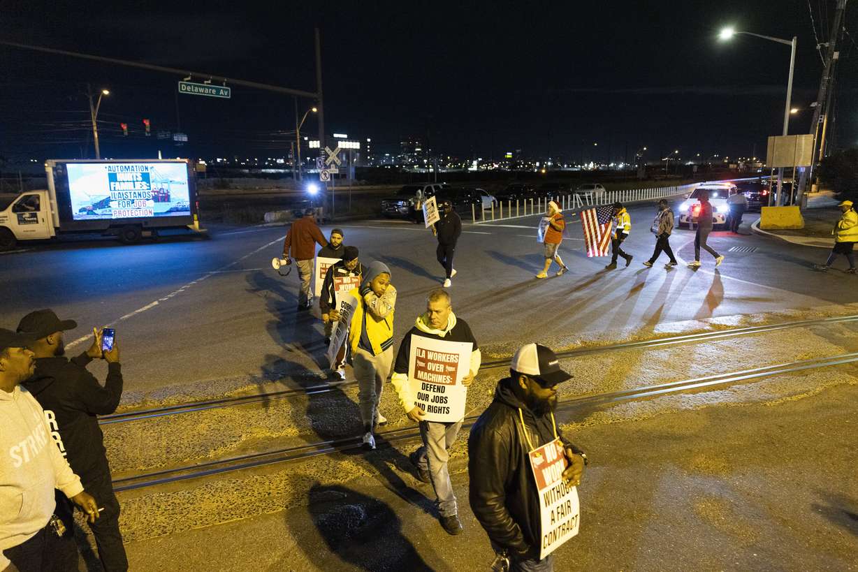 Striking Philadelphia longshoremen picket outside the Packer Avenue Marine Terminal Port, Tuesday.